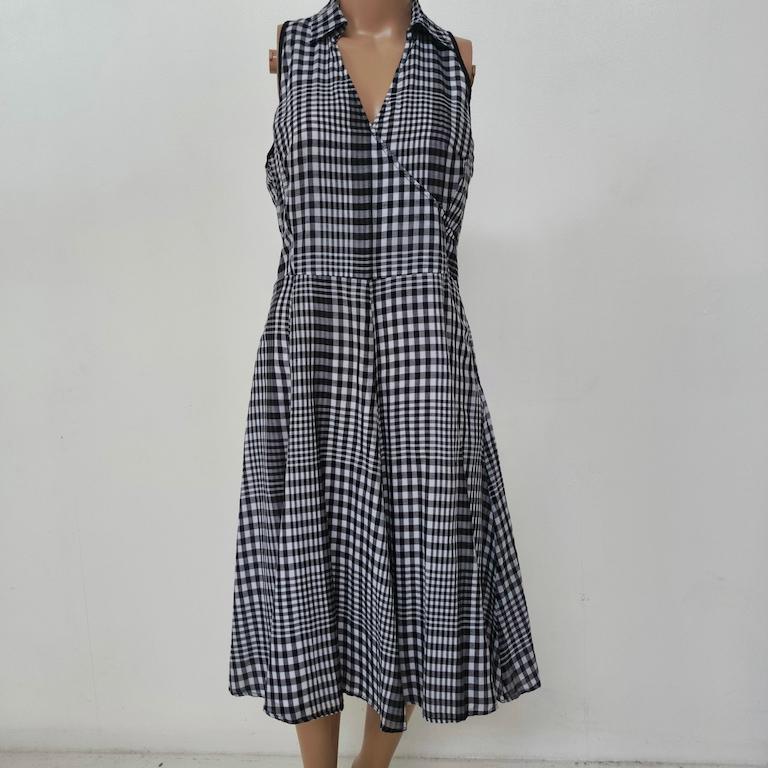 Marella sleeveless midi dress, Italy, 1990s – crisp black-and-white cotton gingham

What makes it special? A clever play on the classic shirt-dress: the gingham is woven, not printed, and Marella pieces together small and medium checks so the