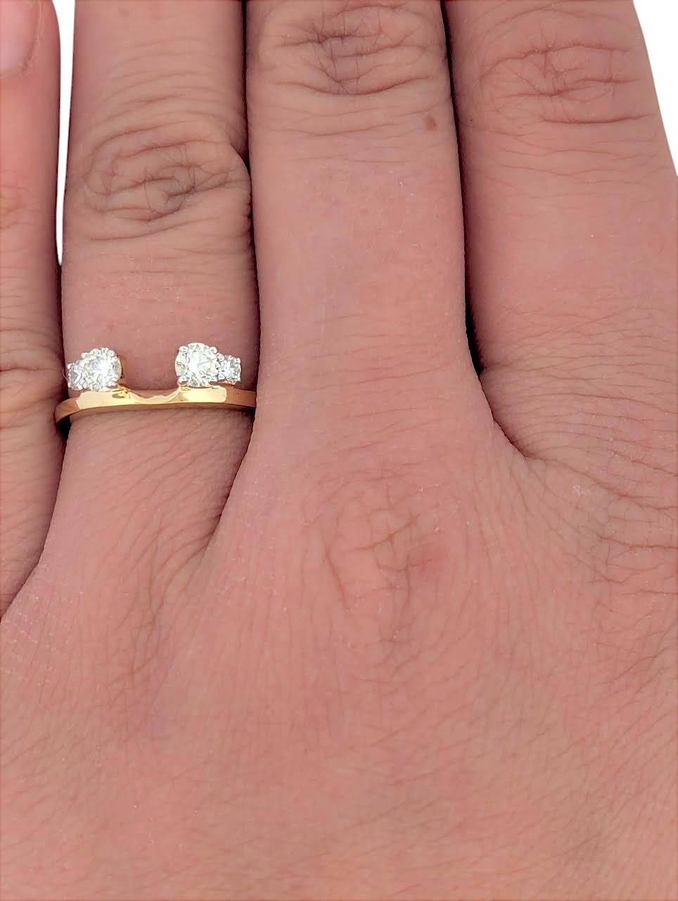Crafted in 14K yellow gold, this wrap-style ring features 0.50 carats of natural diamonds, expertly set to enhance their brilliance. The elegant crossover design creates a contemporary yet timeless look, making it a versatile accessory for both