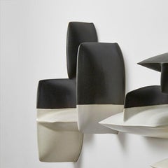 Bronze black and white porcelain wall installation sculpture by Maren Kloppmann