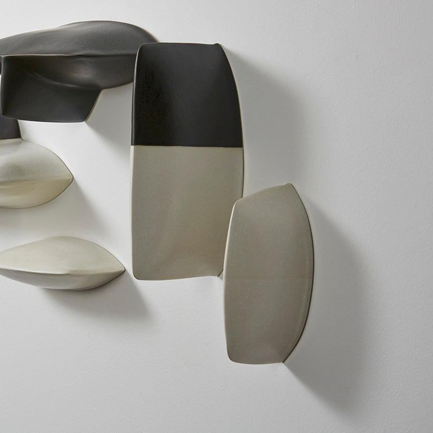 German-born, Minnesota-based Maren Kloppmann is a ceramic artist renowned for her architectonic wall sculptures. Both her large and small-scale installations are studies in the reconciliation of the divergent qualities of natural and man-made