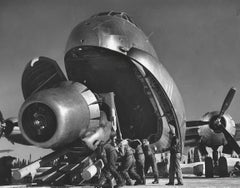 Crewmen unloading huge B-52 bomber engine, Strategic Air Commands’s base, 1951