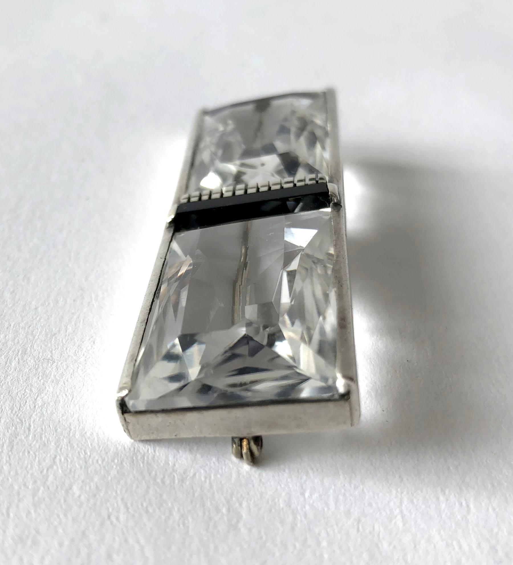 Modernist sterling brooch, featuring black onyx delineating two large baquette cut rock crystal stones created by Margaret De Patta of San Francisco, California.  Brooch measures .75