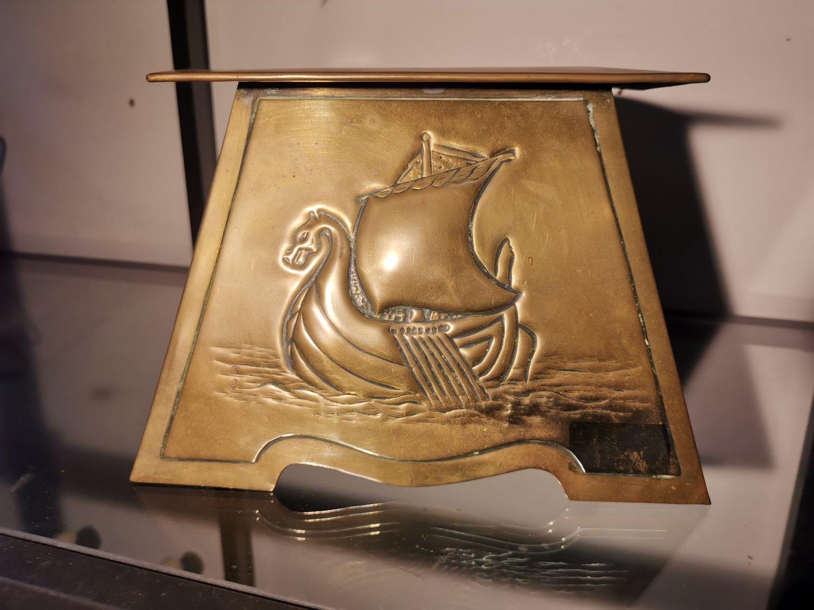 Margaret Gilmour, attributed. 
A Scottish School Arts and Crafts brass planter with flaring top and hand-formed detail depicting a Galleon stood on Gilmour Studios' typical triangular feet.
 