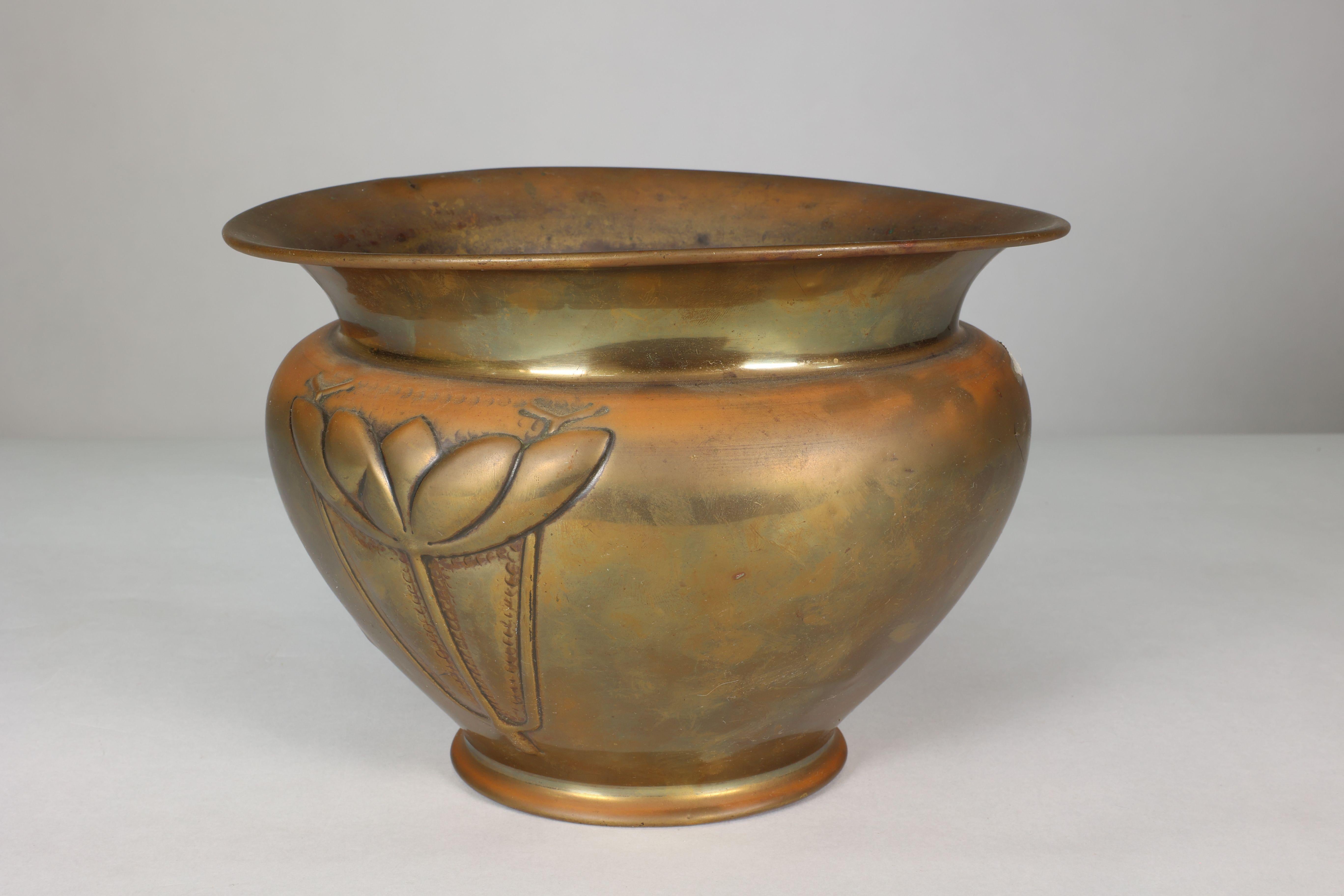 Margaret Gilmour school. A Glasgow style brass planter with stylised floral decoration.