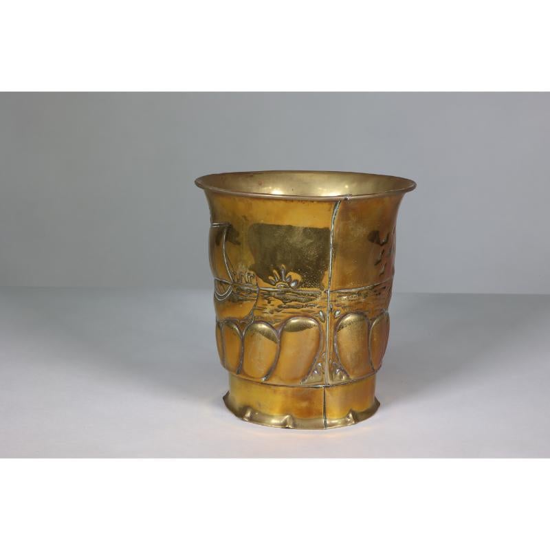 Margaret Gilmour School. A Scottish Arts and Crafts brass planter with a galleon at sea and the rising sun in the distance.
