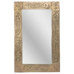 Margaret Gilmour School. An Arts and Crafts oblong brass mirror