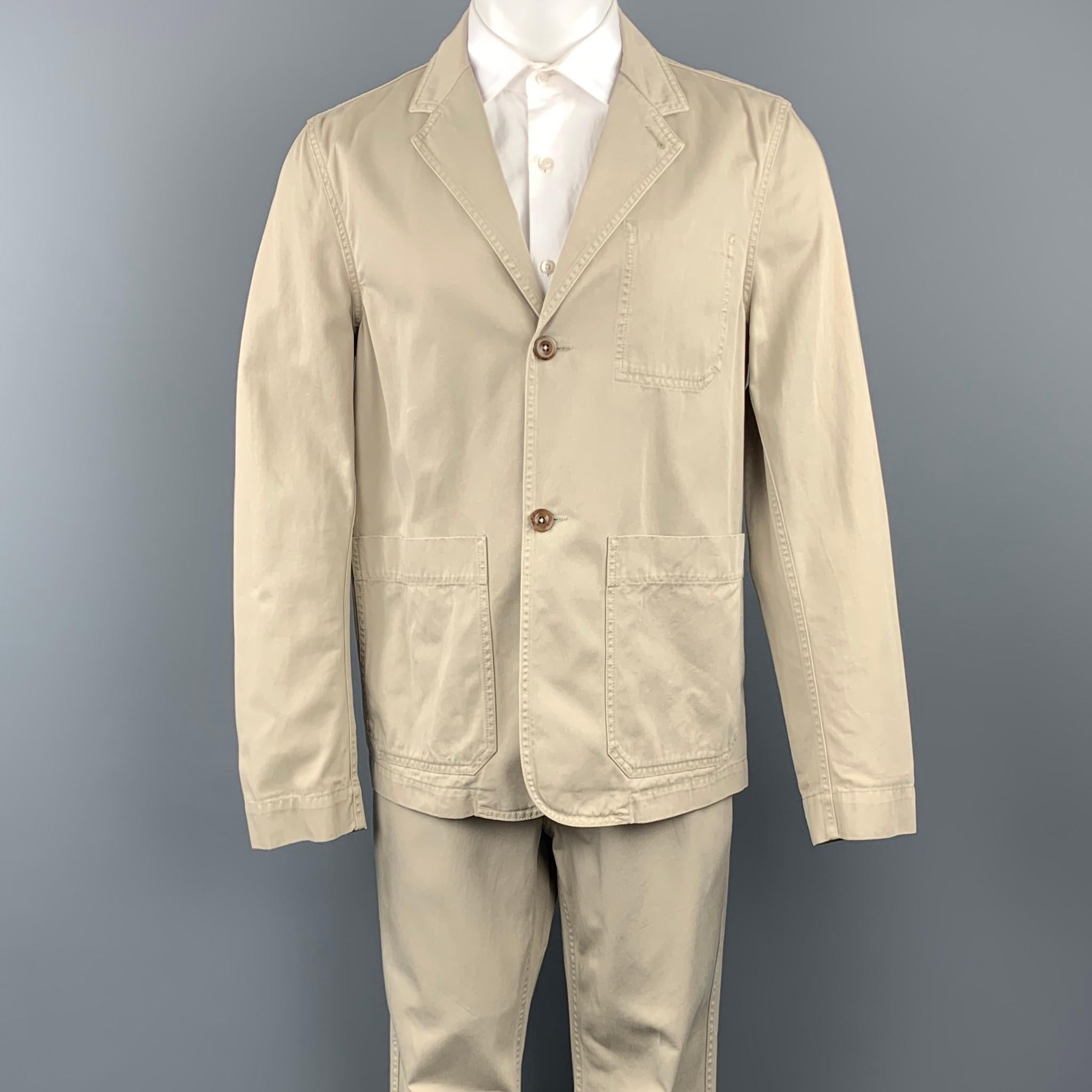 MARGARET HOWELL short suit comes in a khaki cotton and includes a single breasted, two button sport coat with a notch lapel and matching flat front trousers. 

Very Good Pre-Owned Condition.
Marked: M

Measurements:

-Jacket
Shoulder: 18.5 in.