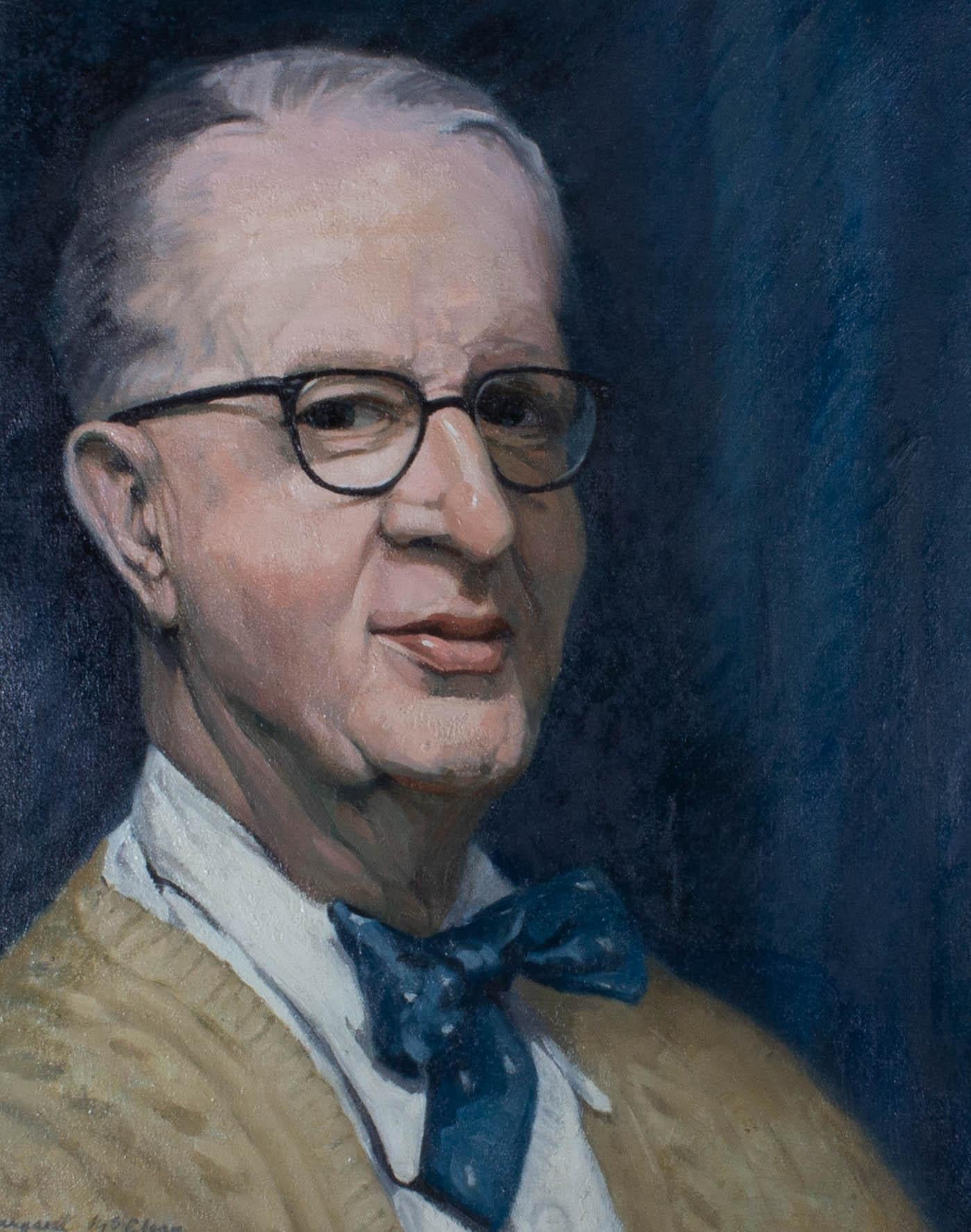 A portrait of a man wearing a blue polka-dot bow tie sat against a blue background. Presented in a substantial painted and distressed frame with a linen slip. Signed to the lower-left edge. On canvas on stretchers.
