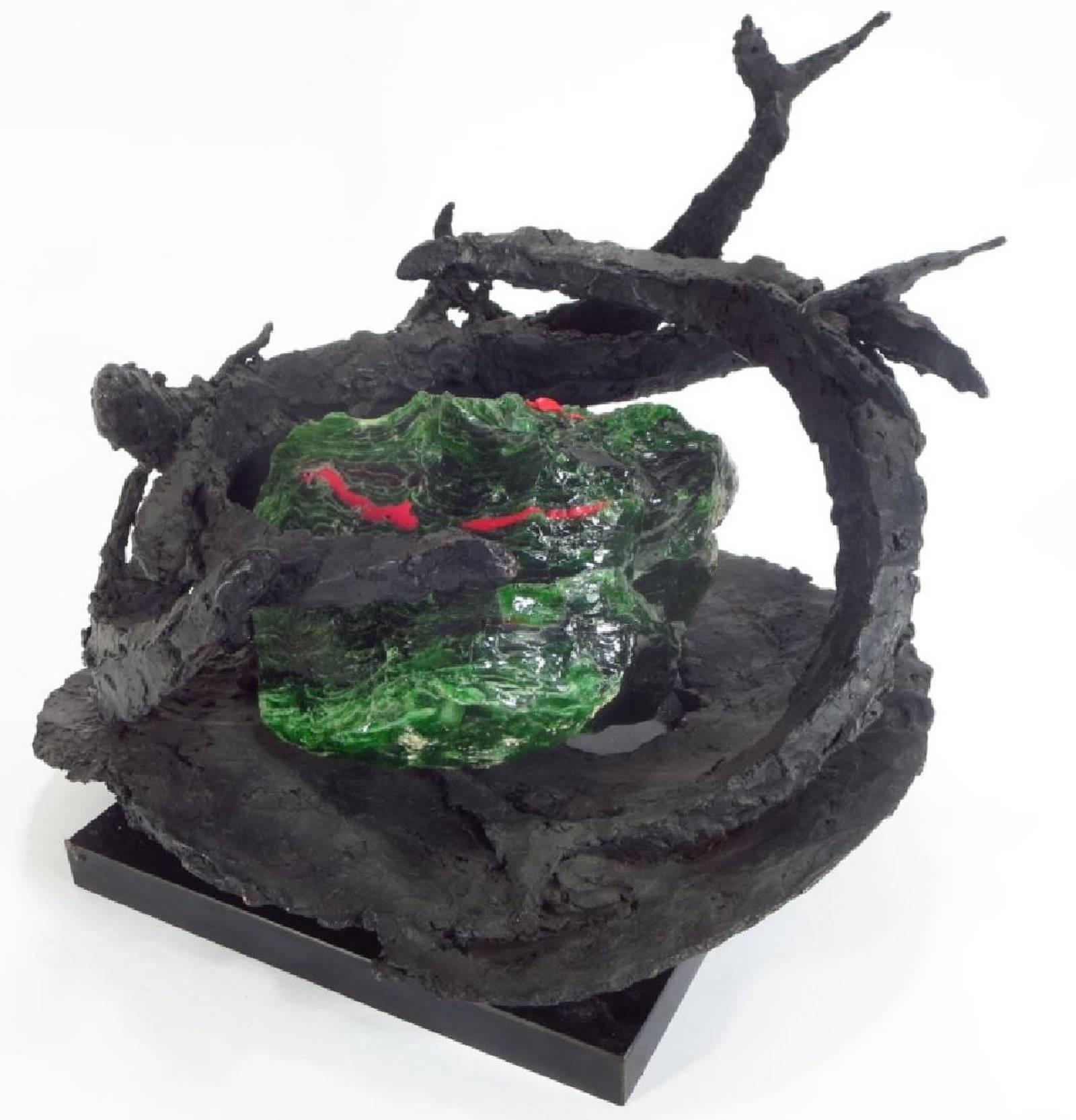 Margaret Reventlow, American born London, 1915 - 2014, "Ten Fathoms Deep", (swimming fish) bronze with green and red slag glass, unsigned, with artist name, title, etc on a label on its swivel base. 
Provenance: From the Estate of Countess Margaret