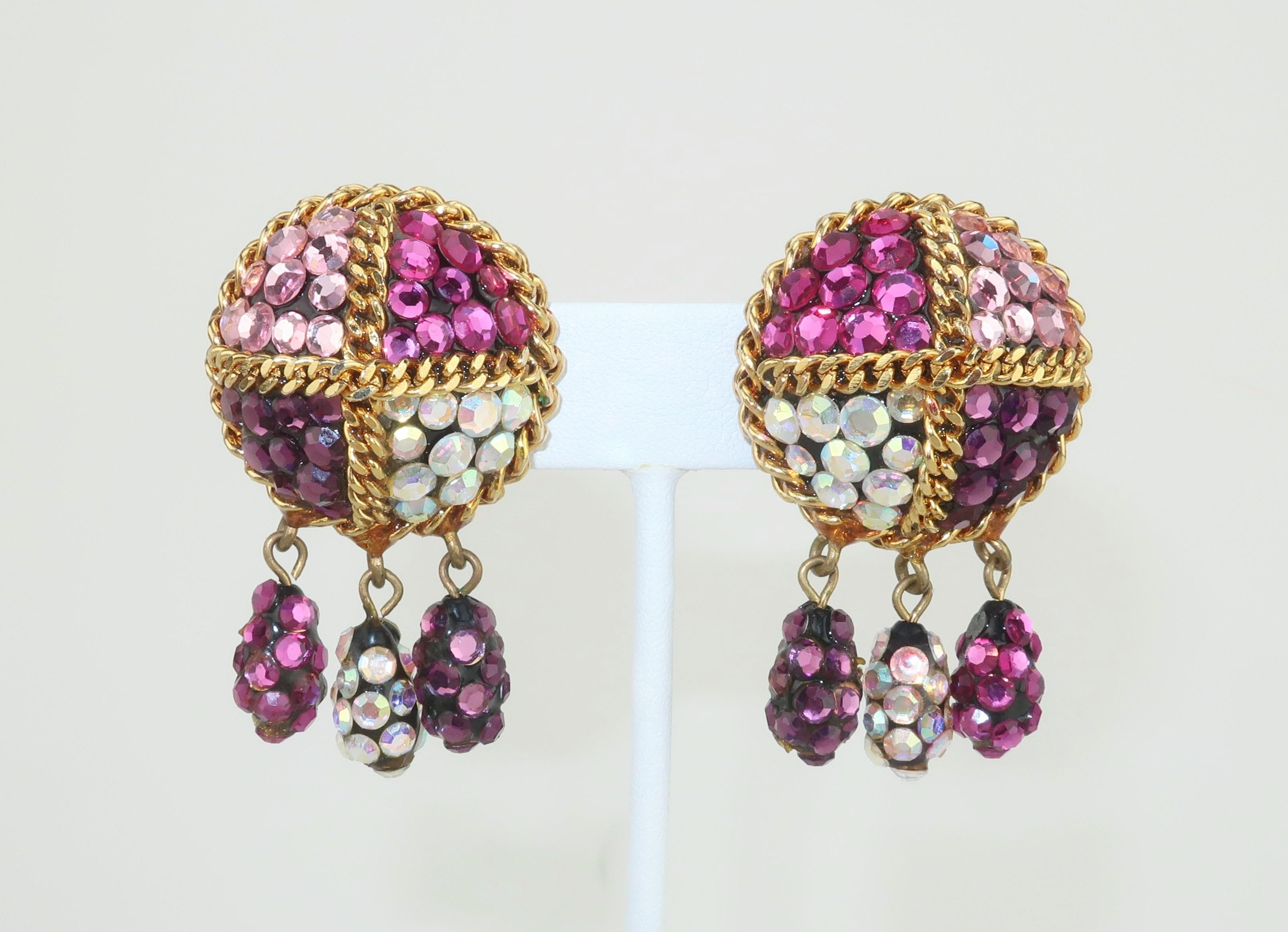 1980's Margaret Squires pave crystal clip on earrings with chain accents and drop dangles.  The crystals are in shades of hot pink, plum, pale pink and champagne on a black resin base.  Designer's label affixed to the back of each