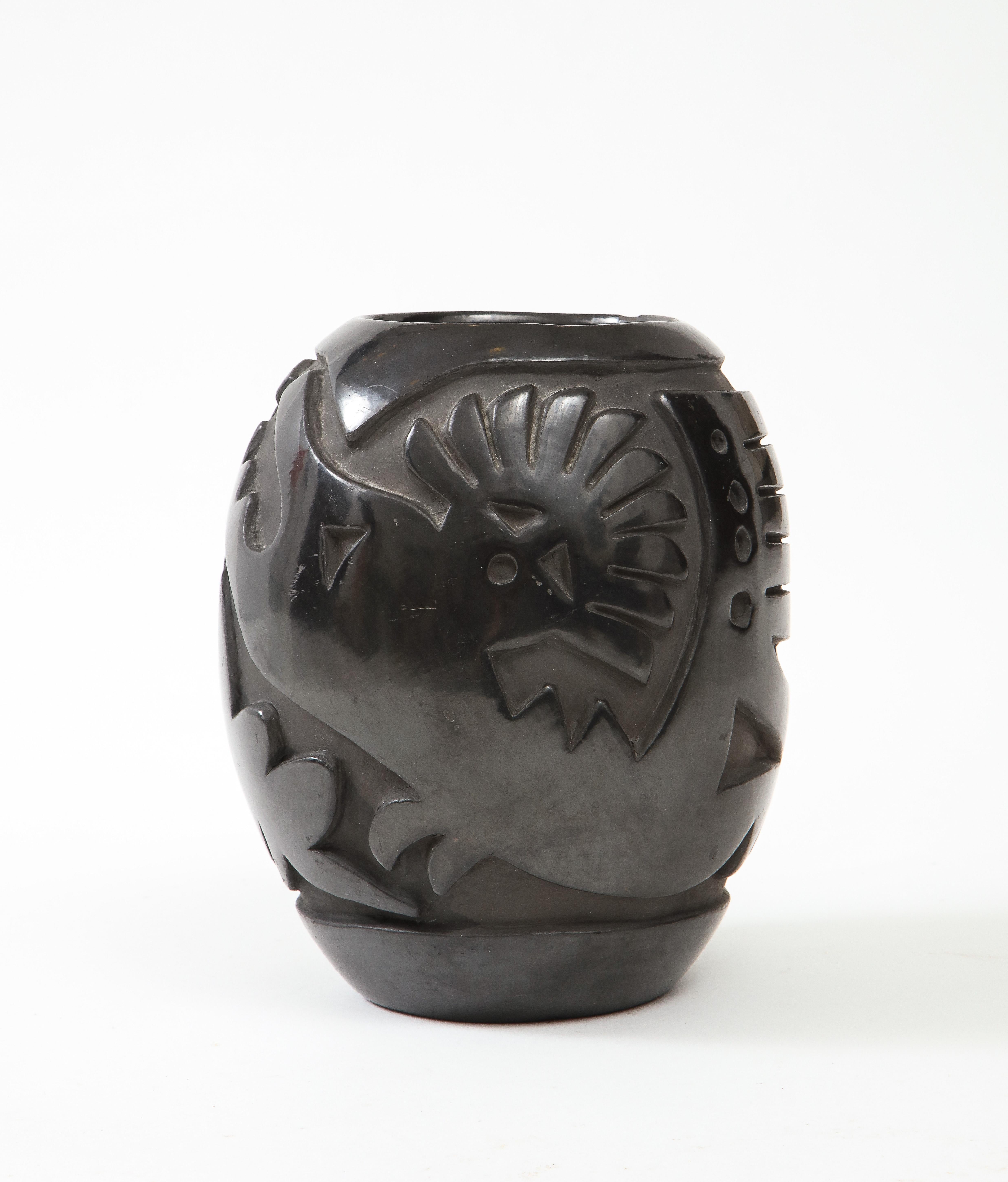 Graphic pattern carved black pottery vase with an exquisite matte finish. Margaret Tafoya pottery. Maria Margarita 