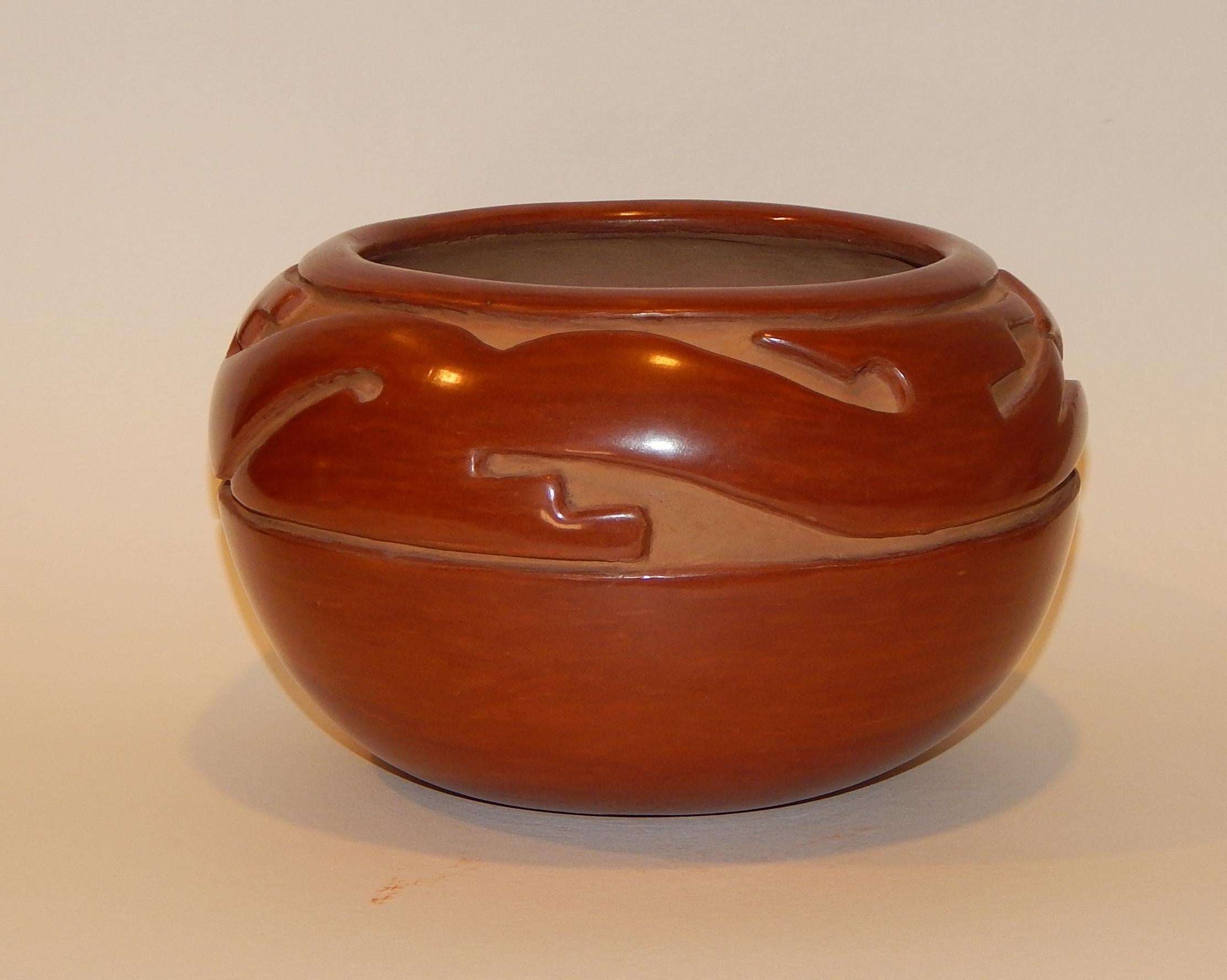Margaret Tafoya (1904-2001) Santa Clara Pueblo ceramic pot
Incised and polished redware. Measures: 5 ½” H x 9