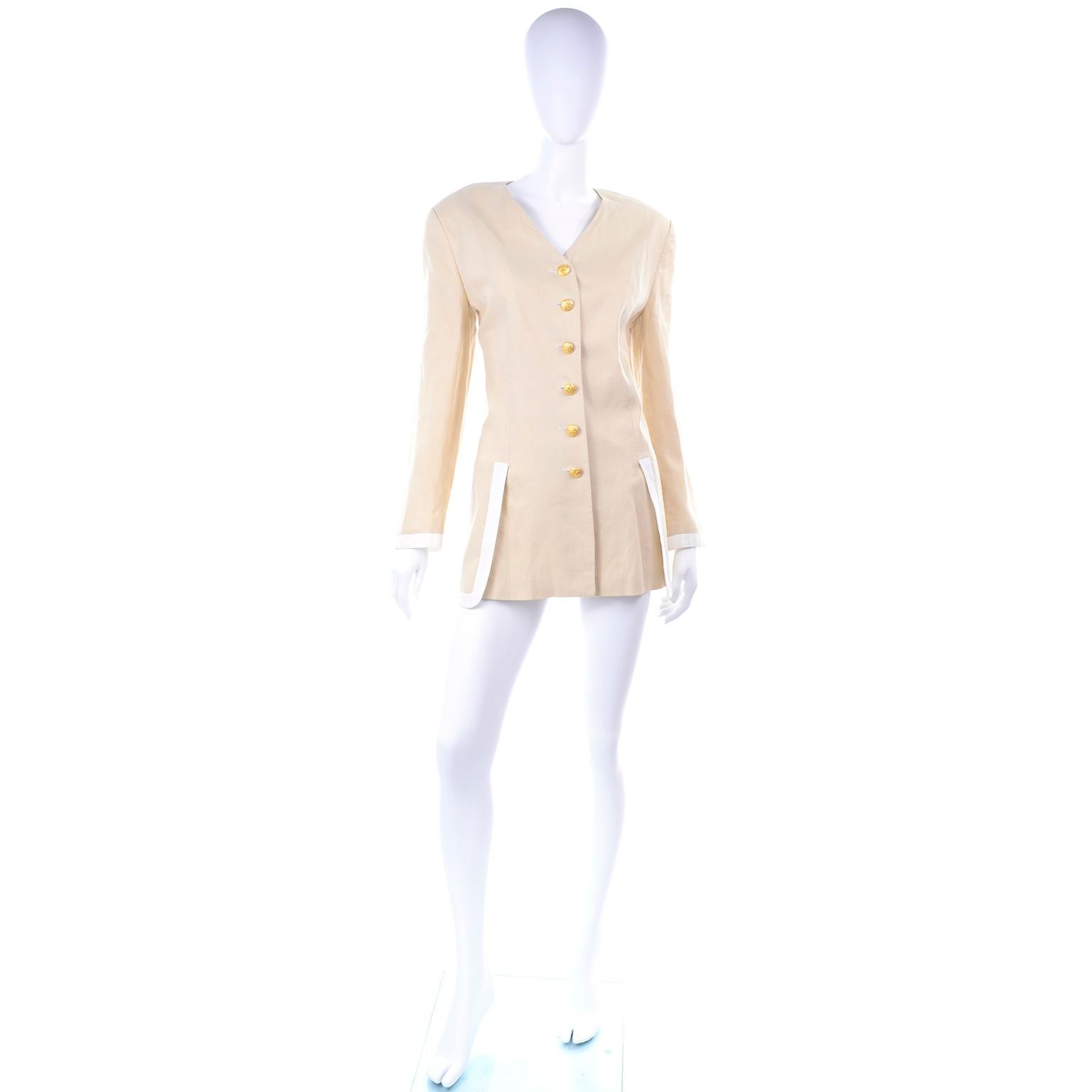 This is a beautiful vintage Escada blazer designed by Margaretha Ley. This versatile jacket was made in Germany, marked as 42, and made of 100% Linen with 100% Rayon lining. The jacket is a pale goldish beige fabric with white cuff & on the split