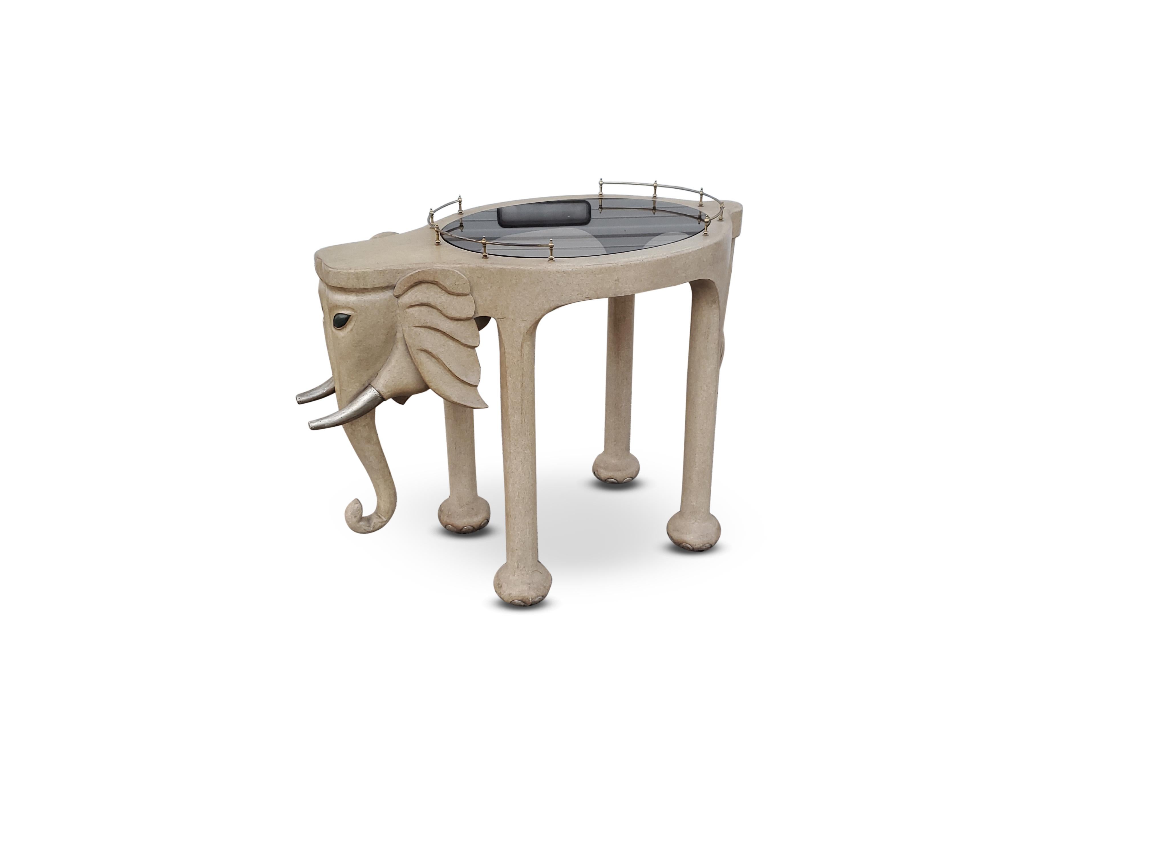 Marge Carson carved wood elephant bar cart

Piece is signed.
