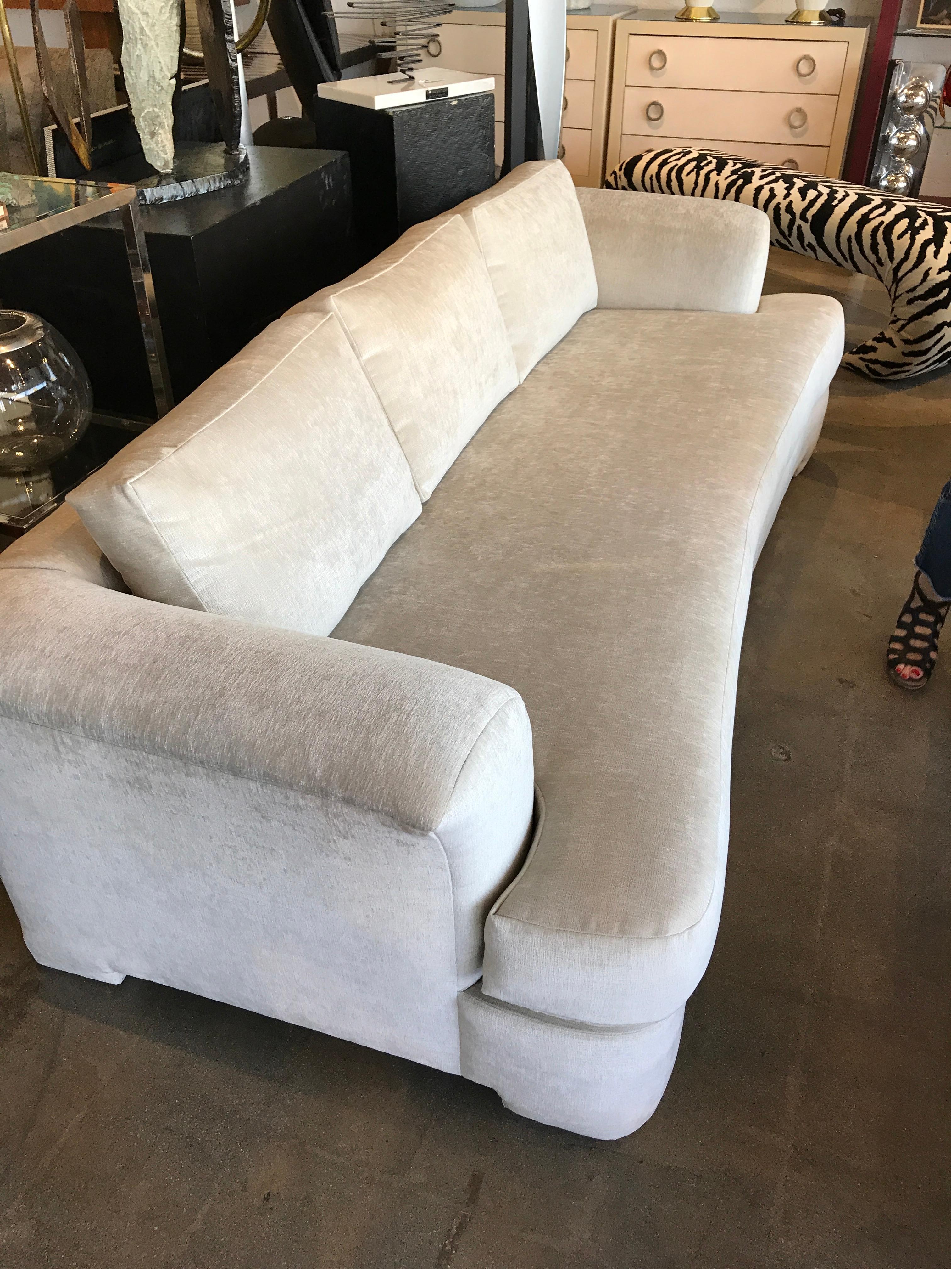 A Marge Carson Hollywood Regency sofa and pair of slipper chairs redone in Knoll Summit fabric in a chalk color. Please see the detailed photo of the fabric. It has been Re-upholstered with new foam. Pictures detail the workmanship. Please see the