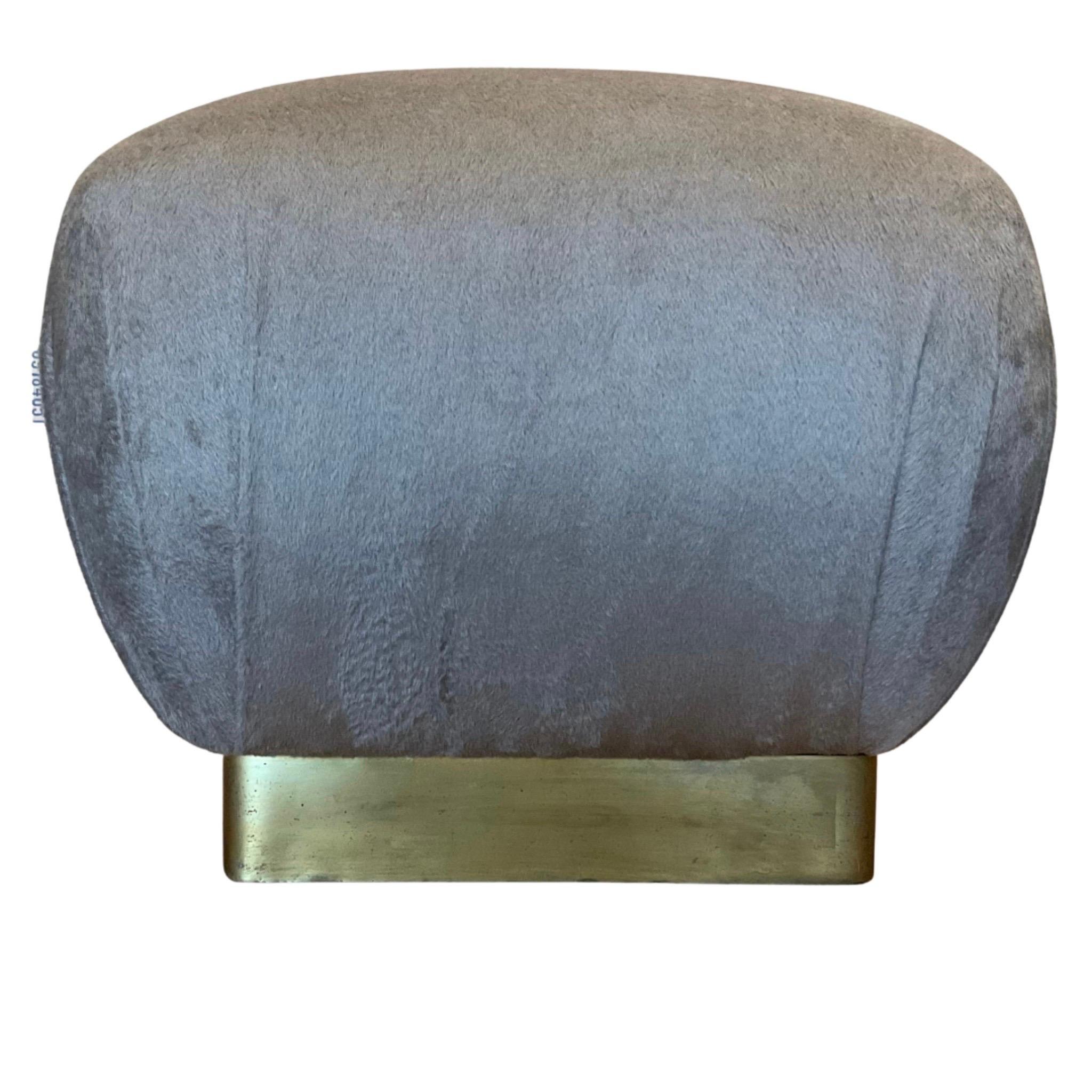 Beautiful Vintage Marge Carson Pair of Poufs
These Ottomans feature a Brass Base
With Beautiful Brand New Angora Wool Upholstery
The Fabric is a very Neutral Taupe Tone
A great accent to any Room
Works well with a Sofa, Lounge Chair, Loveseat, etc.