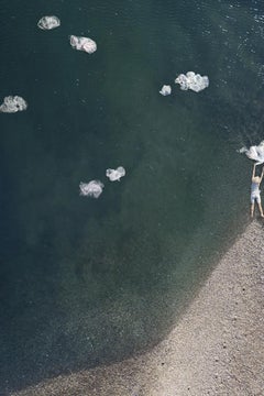 Cumulus - Woman figure floating in ocean water, beach coast, plastic bag clouds
