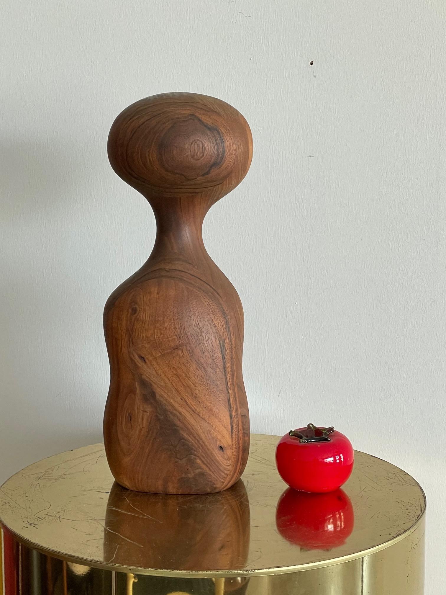 An unusual, laminated walnut sculpture by Margery Goldberg, 1978. 
Margery E. Goldberg (born 1950) is an American artist, art curator, city arts commissioner, and activist. She is best known as the founder and curator of Zenith Gallery in