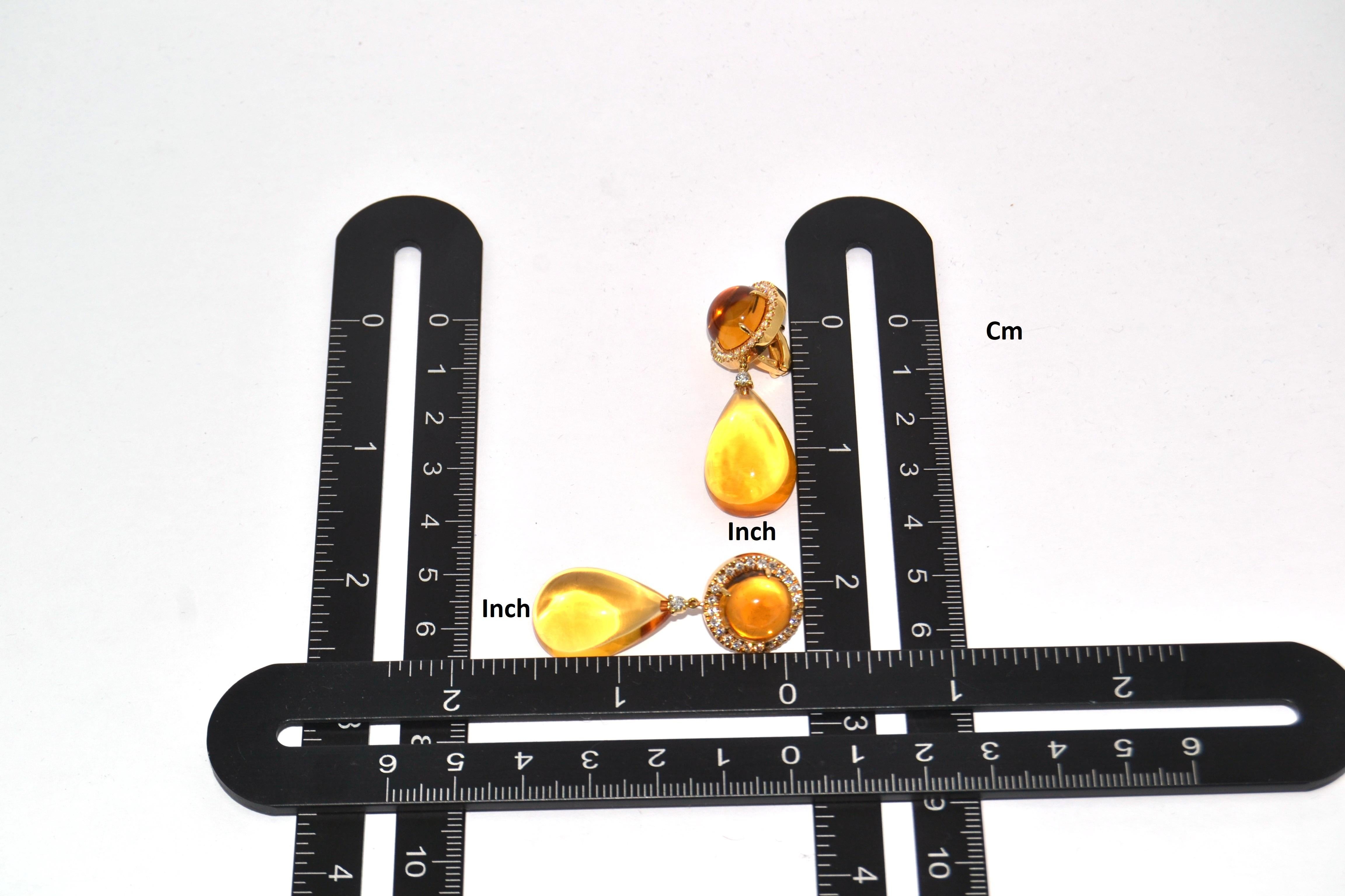 Handcrafted in Margherita Burgener family workshop  based in Valenza, Italy, the lovely earrings are realised in yellow gold.
The top part of the earrings centers round cabochon cut citrine quartz.
A single diamond is connecting the top with the