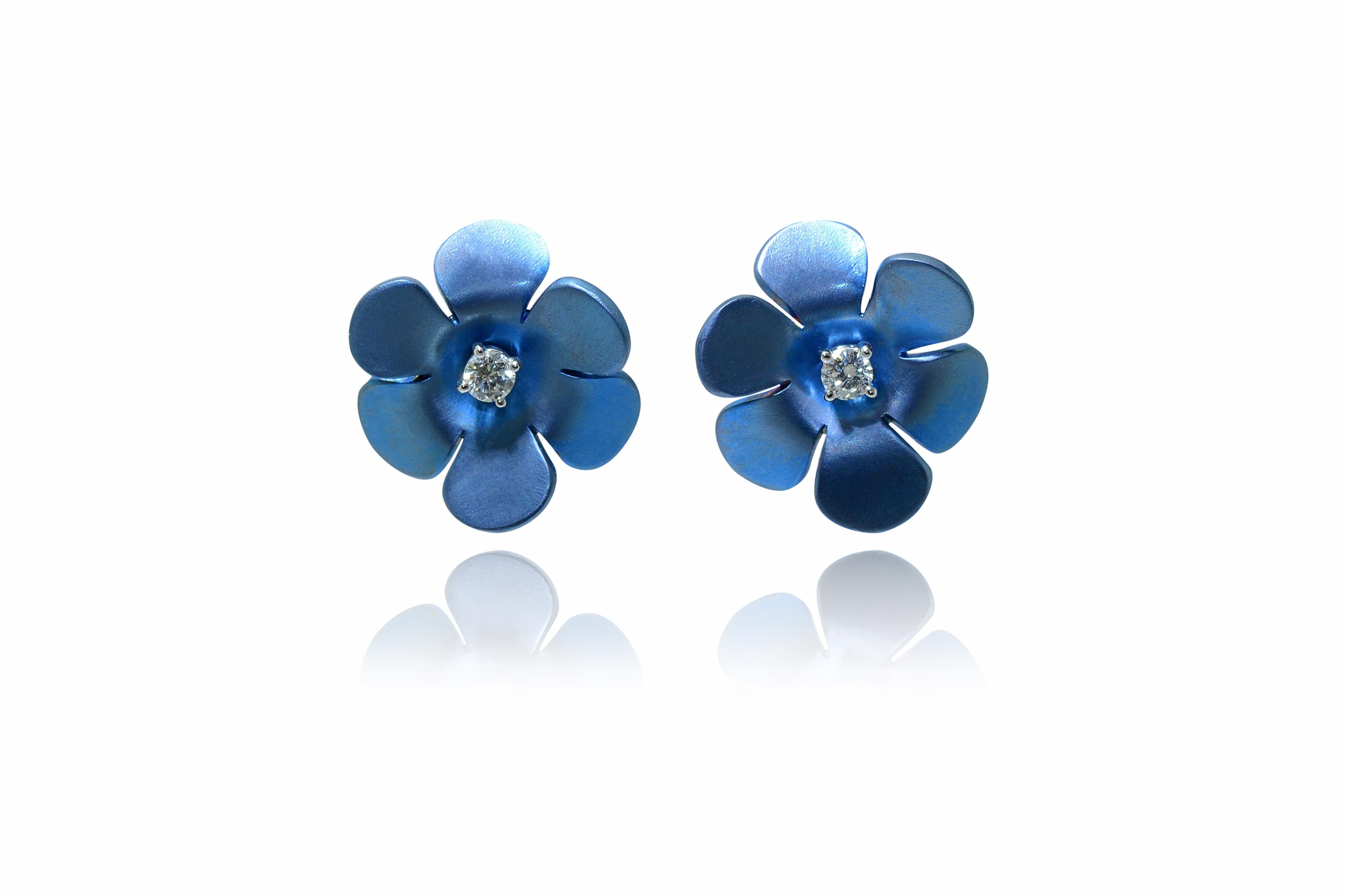 Handcrafted in Margherita Burgener family workshop located in Valenza, Italy, the  earrings flower motif are centering a single diamond, set in 18 Kt white gold. 
Studs diamond can be taken out and used as single studs.
Perfect everyday precious