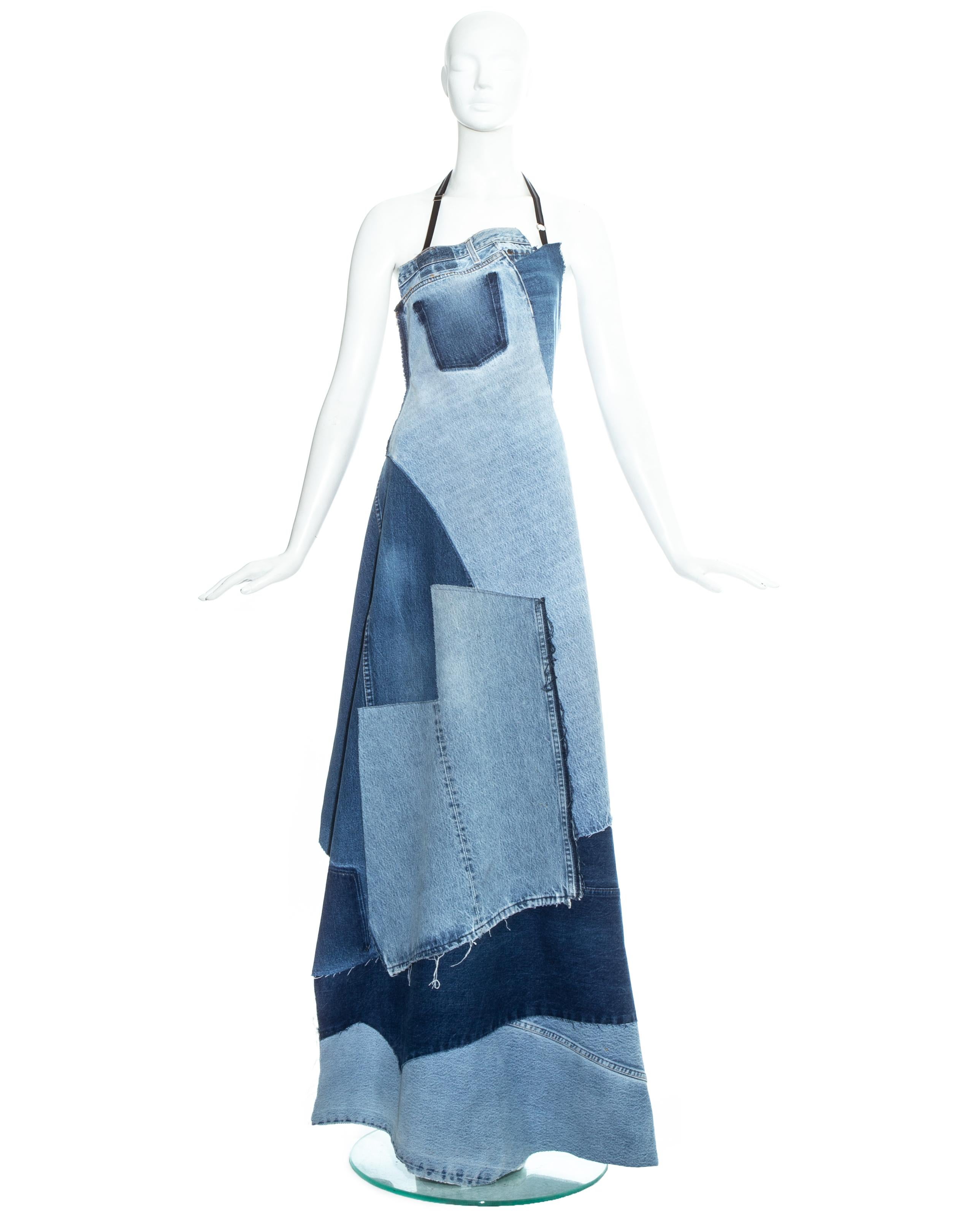 Martin Margiela; Artisanal denim apron maxi dress constructed from vintage jeans. Adjustable black elastic fastenings on neck and waist. 

Spring-Summer 1999