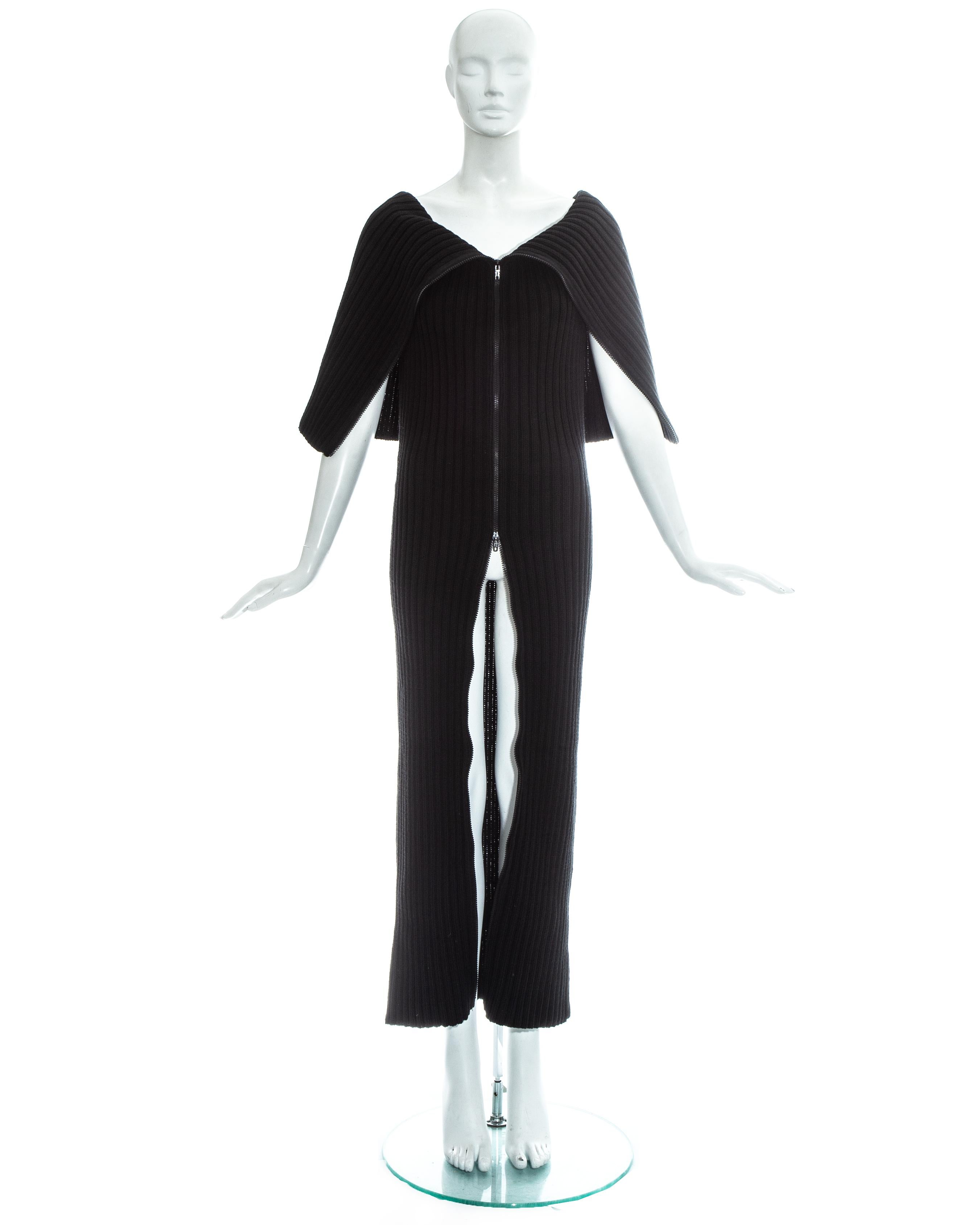 Martin Margiela; black wool rib knit tube dress with double ended zipper and oversized collar. Produced by Miss Deanna.

Fall-Winter 1998

Image 3: Courtesy of Condé Nast Archive
Image 7: Studio Voice,  July 1998, ph. Ronald Stoops
Image 9: High