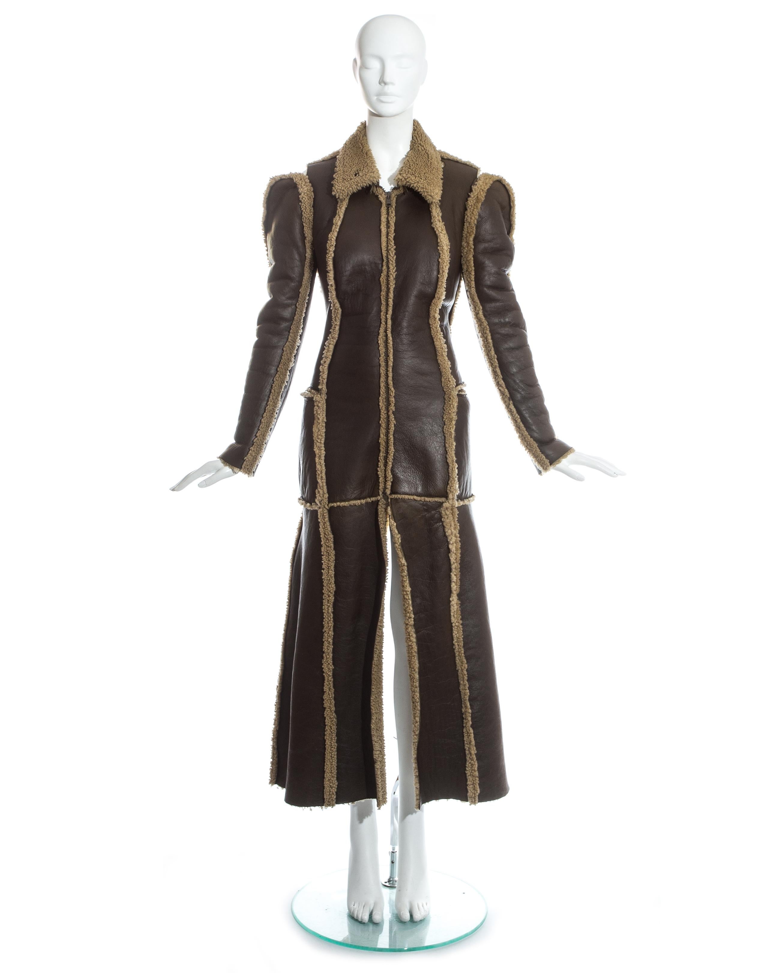 Martin Margiela; brown leather and shearling 'flat collection' maxi coat. Inverted seams, zip closures, two front patch pockets and detachable collar. Openings on the shoulder attached to an internal large elastic band with velcro fastening.