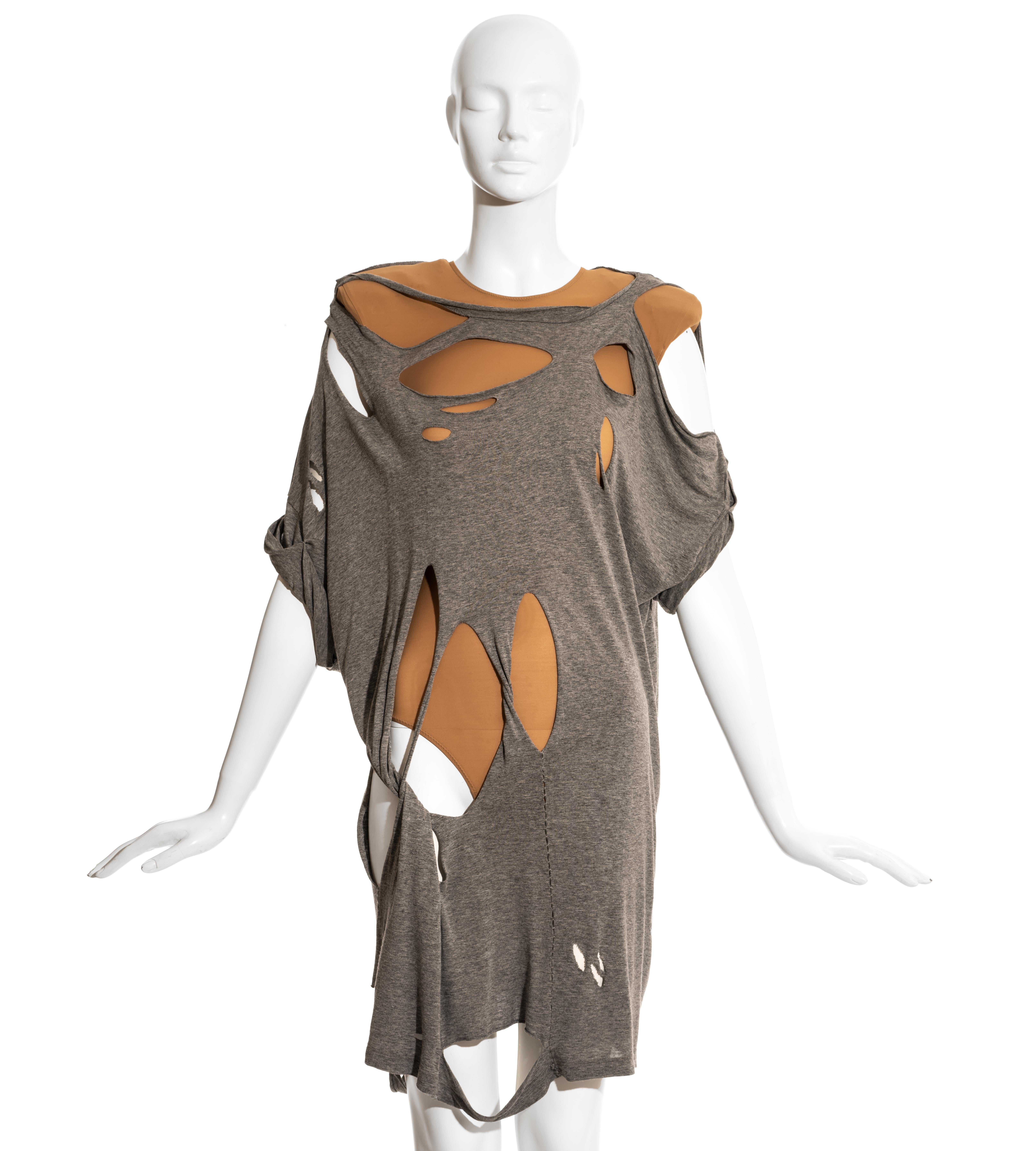 Martin Margiela runway ensemble comprising: grey cotton oversized shredded t-shirt and nude lycra bodysuit with padded shoulders.

Spring-Summer 2009