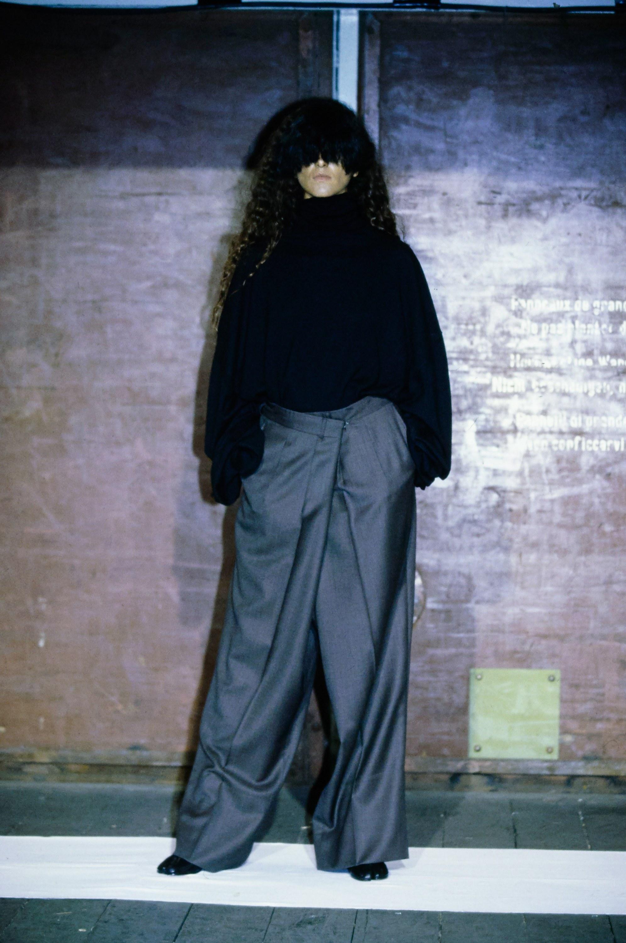 Martin Margiela; grey wool oversized pants. Size IT 78 reconstructed and folded to fit a size small. Box pleat at the centre back, wrap design at front fastening with a hook and eye closure. 

Fall-Winter 2000

Image 8:  US Vogue (July 2000) ph.