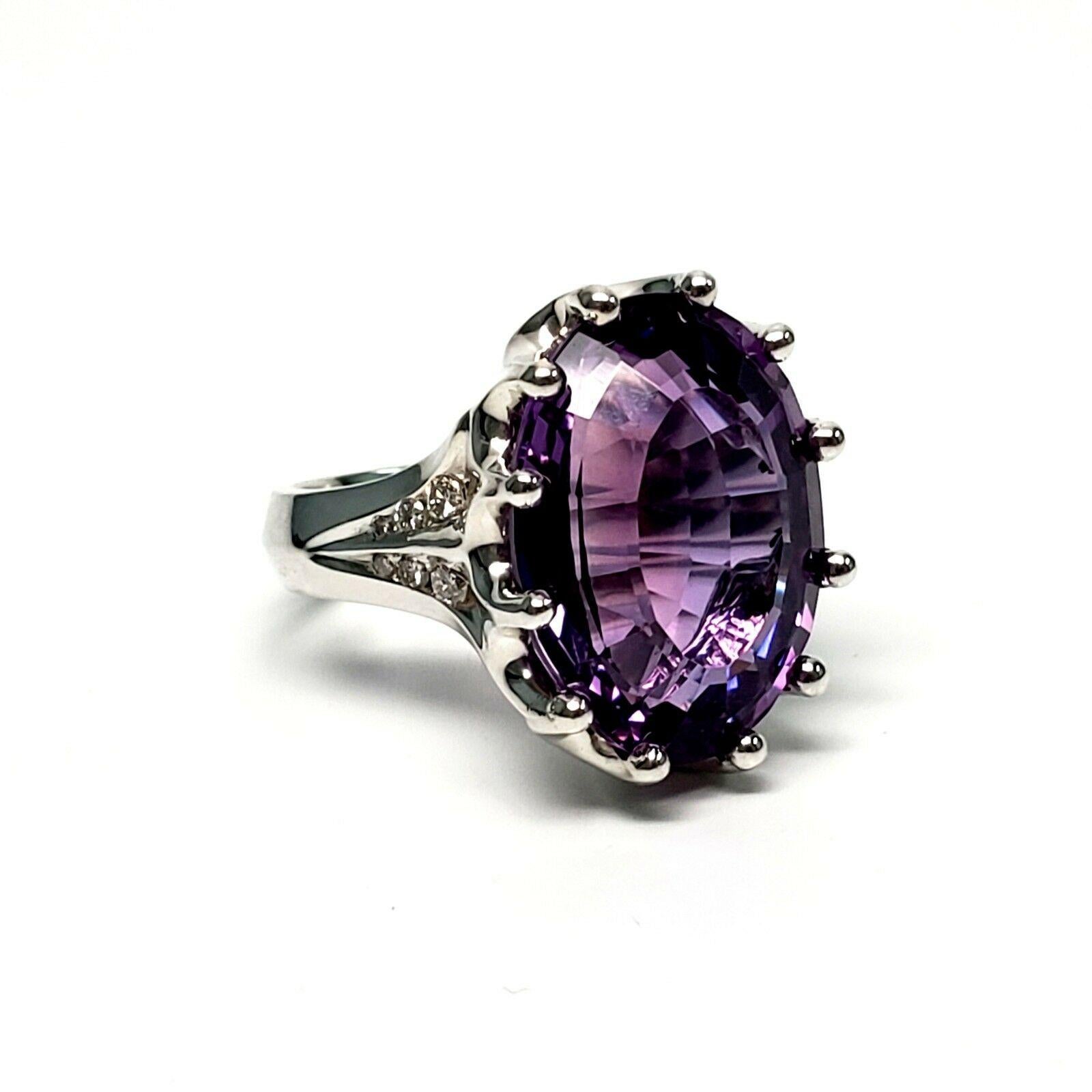 Margot Manhattan Sterling Silver Amethyst and Diamond Ring, size 8.

This is a beautiful sterling silver ring by designer Margo of Manhattan featuring a very large oval shaped faceted amethyst in a prong setting with 6 small round diamonds on each