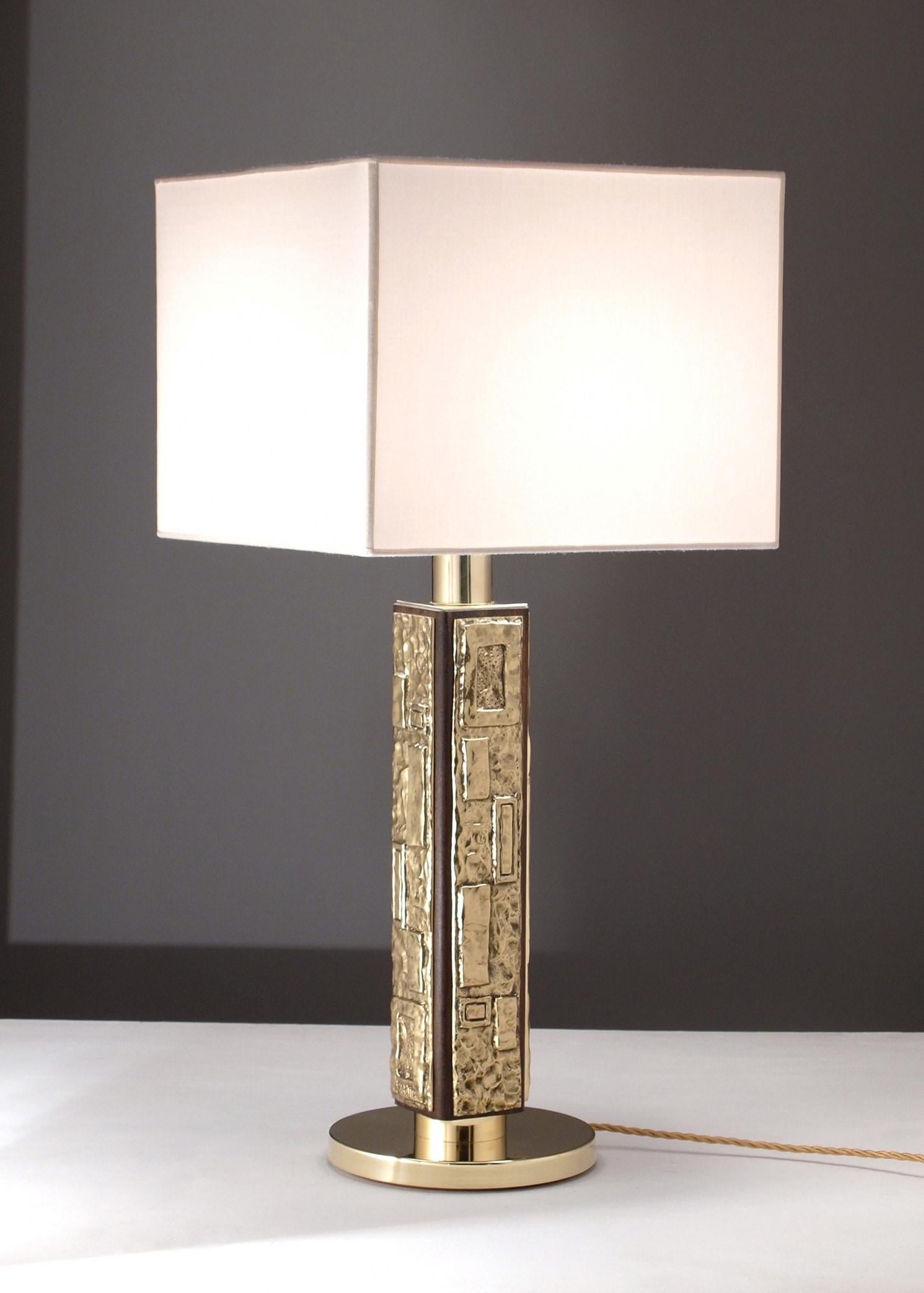 Lamp with base in brass or brass fusion, frame in black lacquered wood or walnut essence, with particular decorative bands in artistic fusion decorated and signed by the designer. Circular lampshade in ivory colored shantung. Contact us for custom