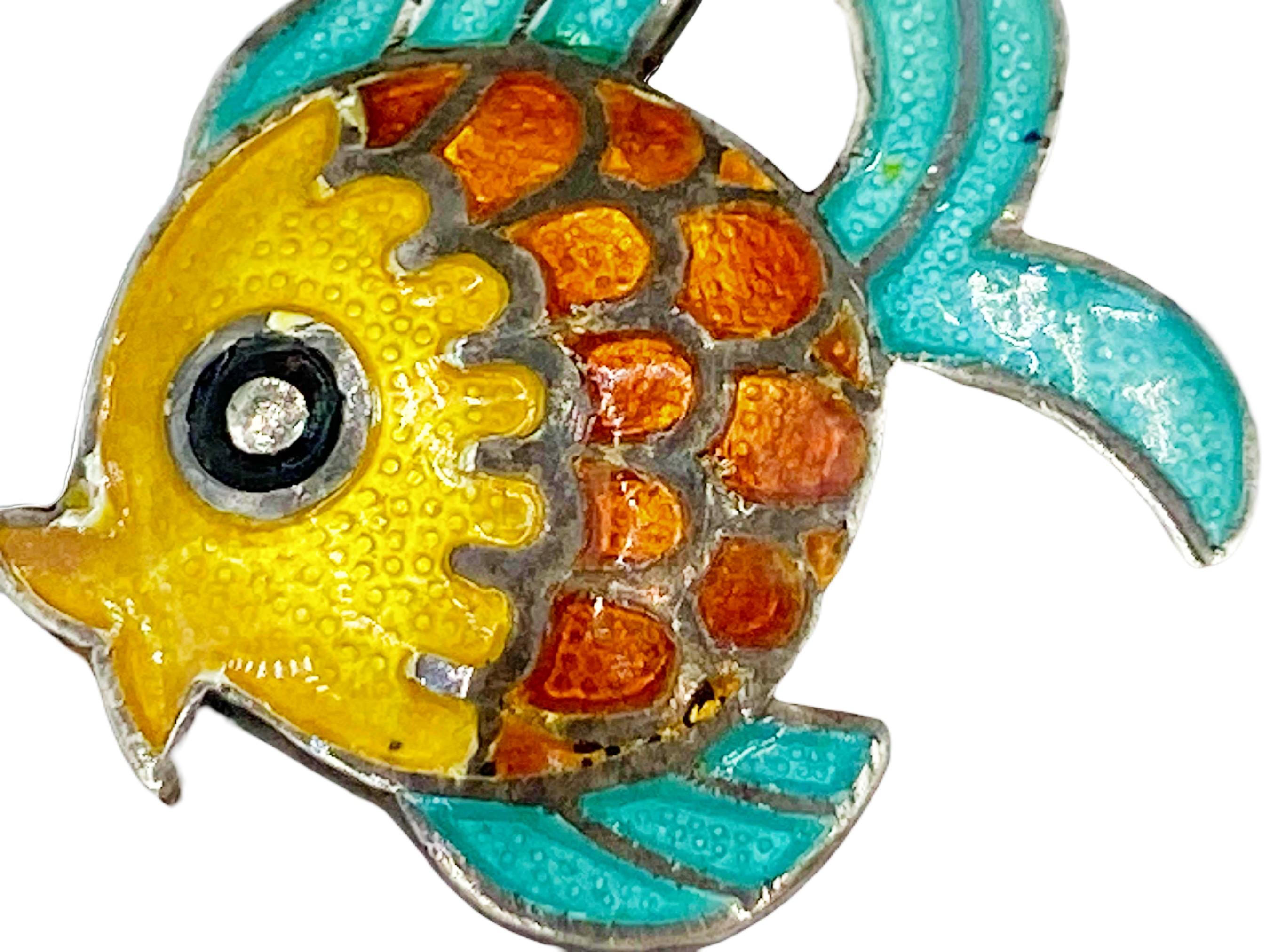 These earrings are brimming with personality! One of Margot de Taxco's most beloved designs, the Circle Fish, this delightful pair of Sterling Silver tropical fish features vivid turquoise, sunshine yellow and sunset orange champlevé enamel to