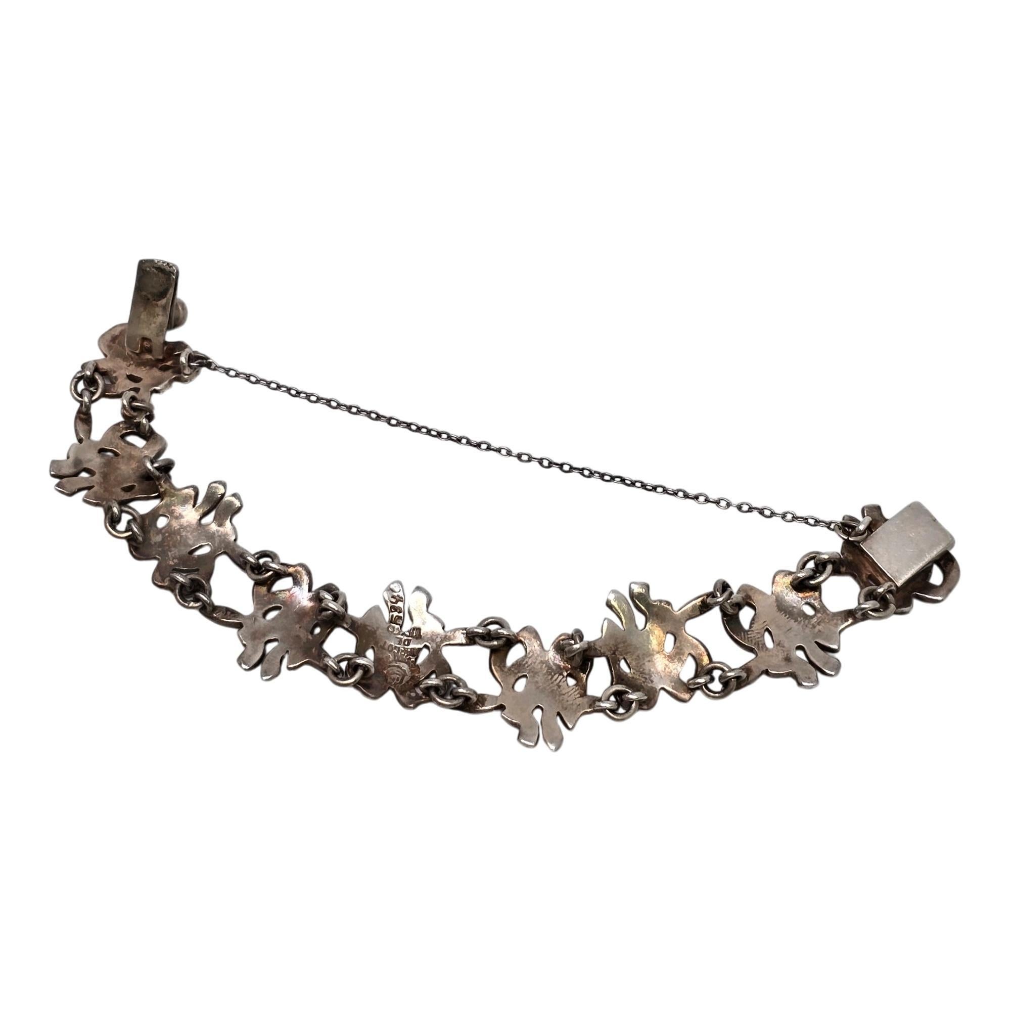 Armband aus Sterlingsilber mit Blättern und Bändern von Margot de Taxco aus Mexiko, Muster # 5346, ca. 1950er Jahre.

Schönes Gliederarmband der bekannten Taxco-Künstlerin Margot Van Voorhies, auch bekannt als Margot de Taxco. Mit seinen