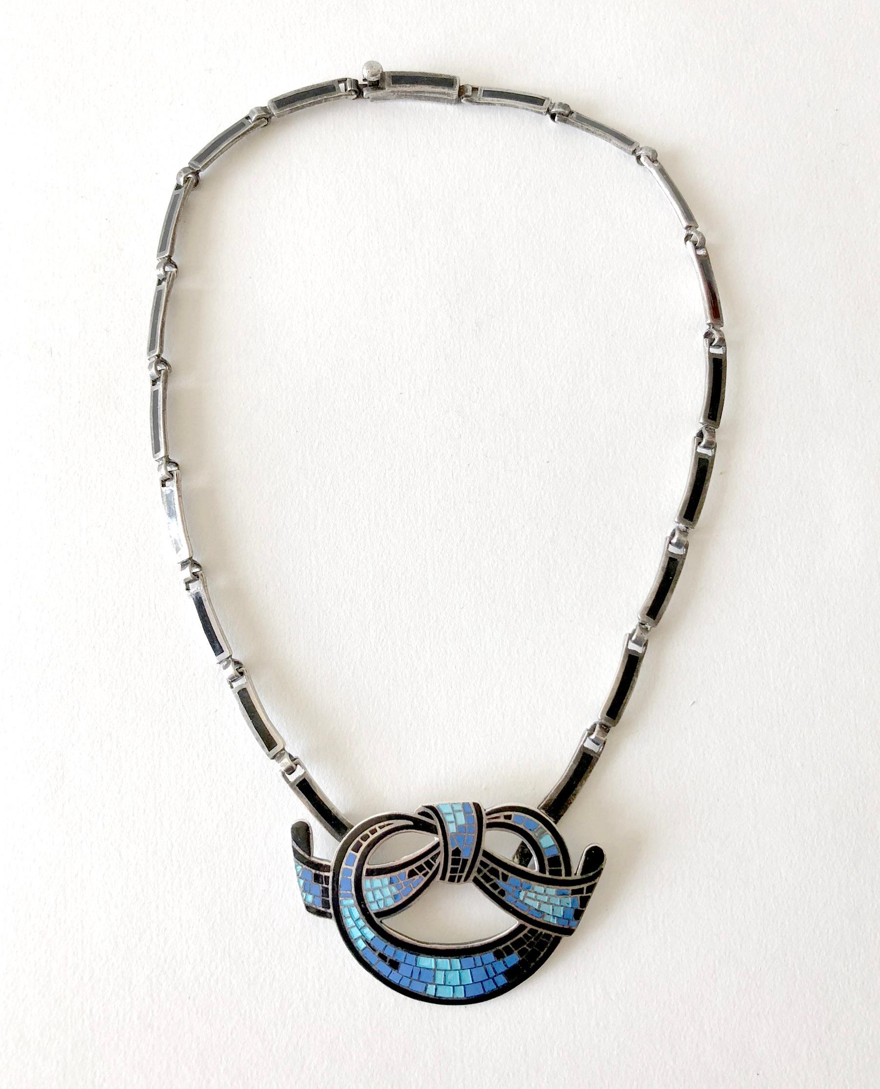 Gorgeous mosaic enameled sterling silver necklace which can convert to a brooch created by Mexican modernist jeweler, Margot de Taxco.  Necklace chain measures 16