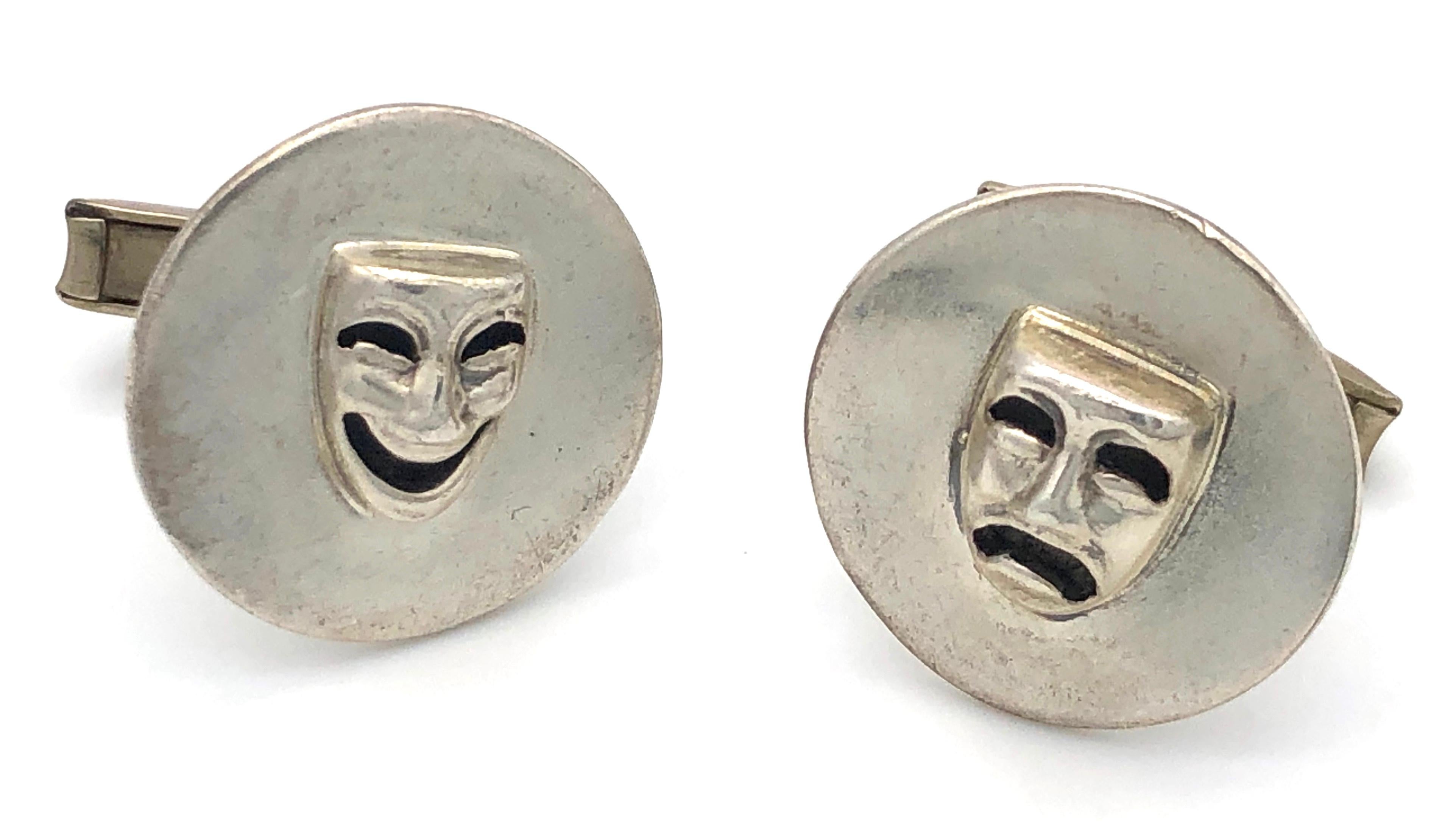 Highly amusing Margo De Taxco cufflinks made out of sterling silver and fully signed.
The round discs feature a happy and a not so happy mask.