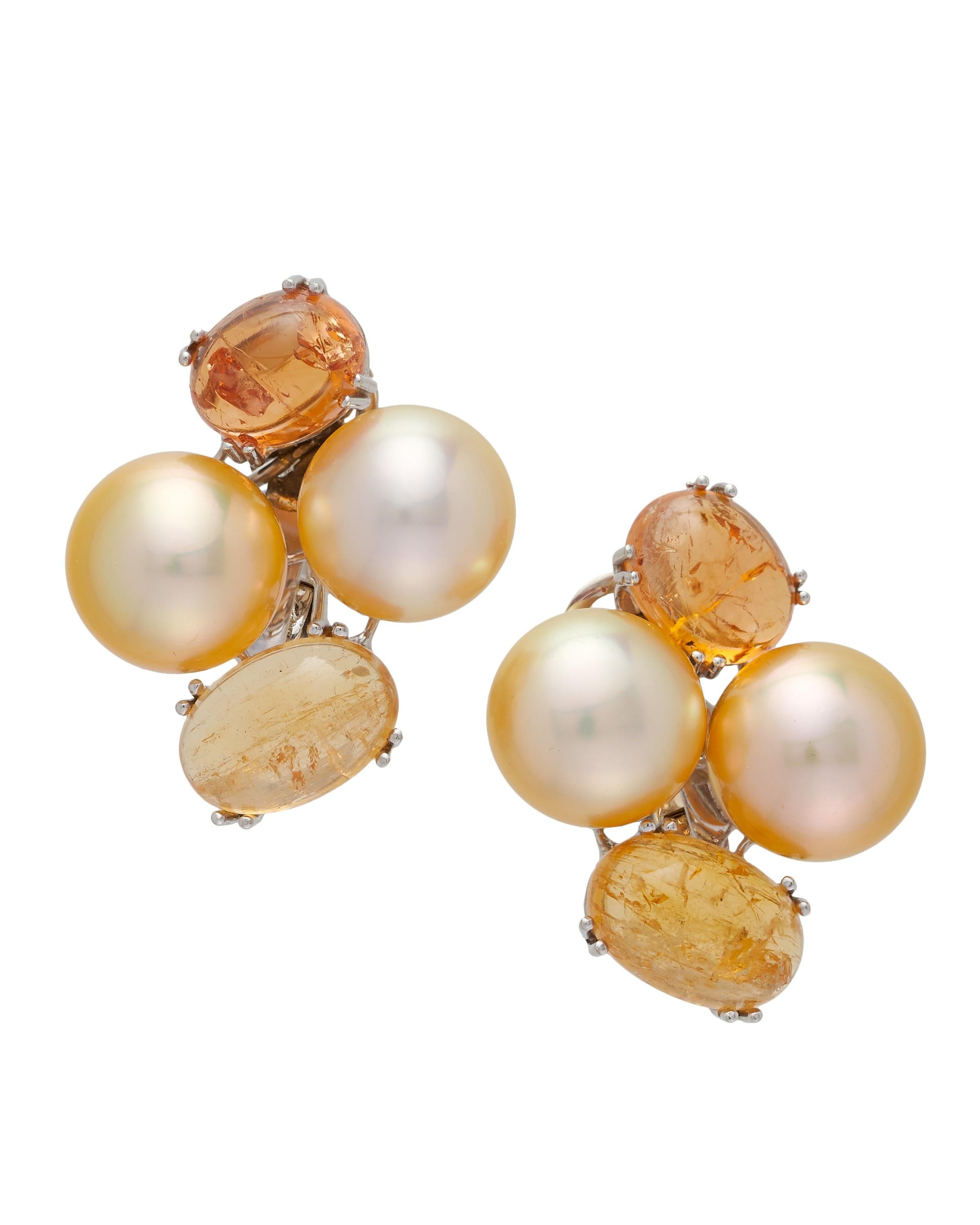 Margot McKinney 18 Karat Yellow Gold Earrings set with Golden South Sea Pearls 42.6ct being 11.6x11.9mm and oval cabochon rutilated Yellow Topaz and Yellow Sapphire weighing in total 20.60ct.  Clip suits both pierced and non-pierced ears.
