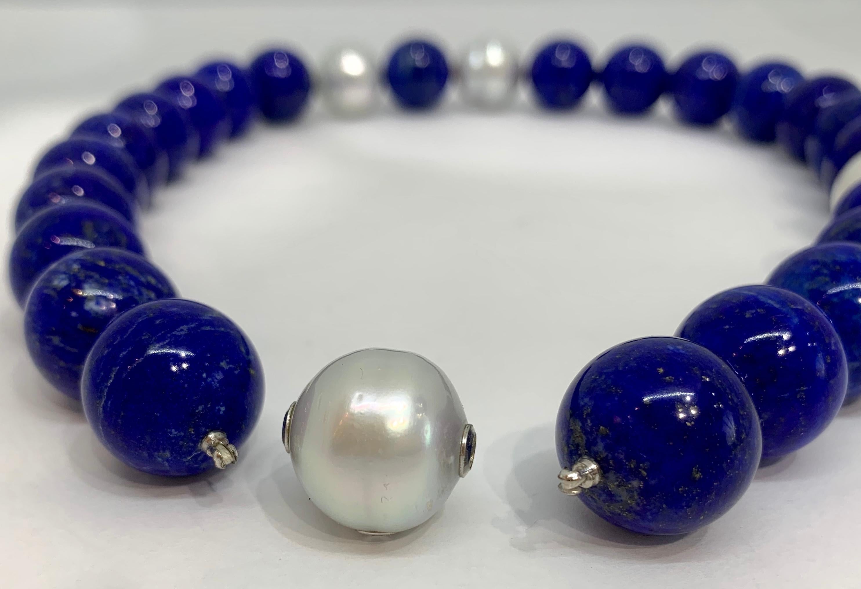 Margot McKinney 18 Karat White Gold Pearl and Lapis Necklet featuring four White Circle 17mm - 18mm Australian South Sea Pearls and twenty-three 18mm Lapis Lazuli Beads, Length 49cm.  Clasp is an interchangeable 17mm - 17.5mm Pearl with an 0.10ct