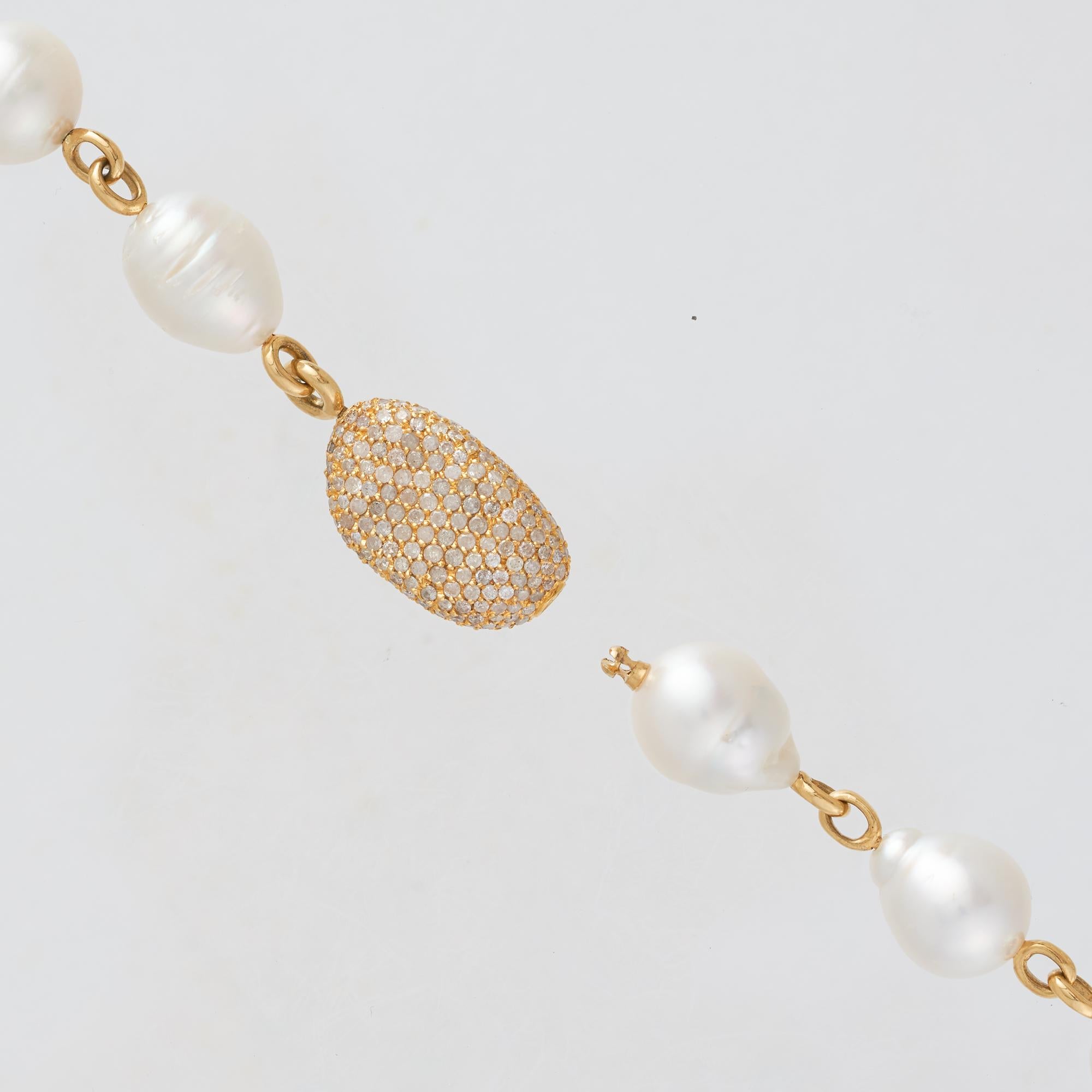 Margot McKinney 18 karat Yellow Gold South Sea Pearl and Diamond Pebble Necklet featuring forty-three 14-15.5mm white baroque Australian South Sea pearls, one 18 karat Yellow Gold pave set Diamond Pebble, all joined with 18 karat Yellow Gold fancy