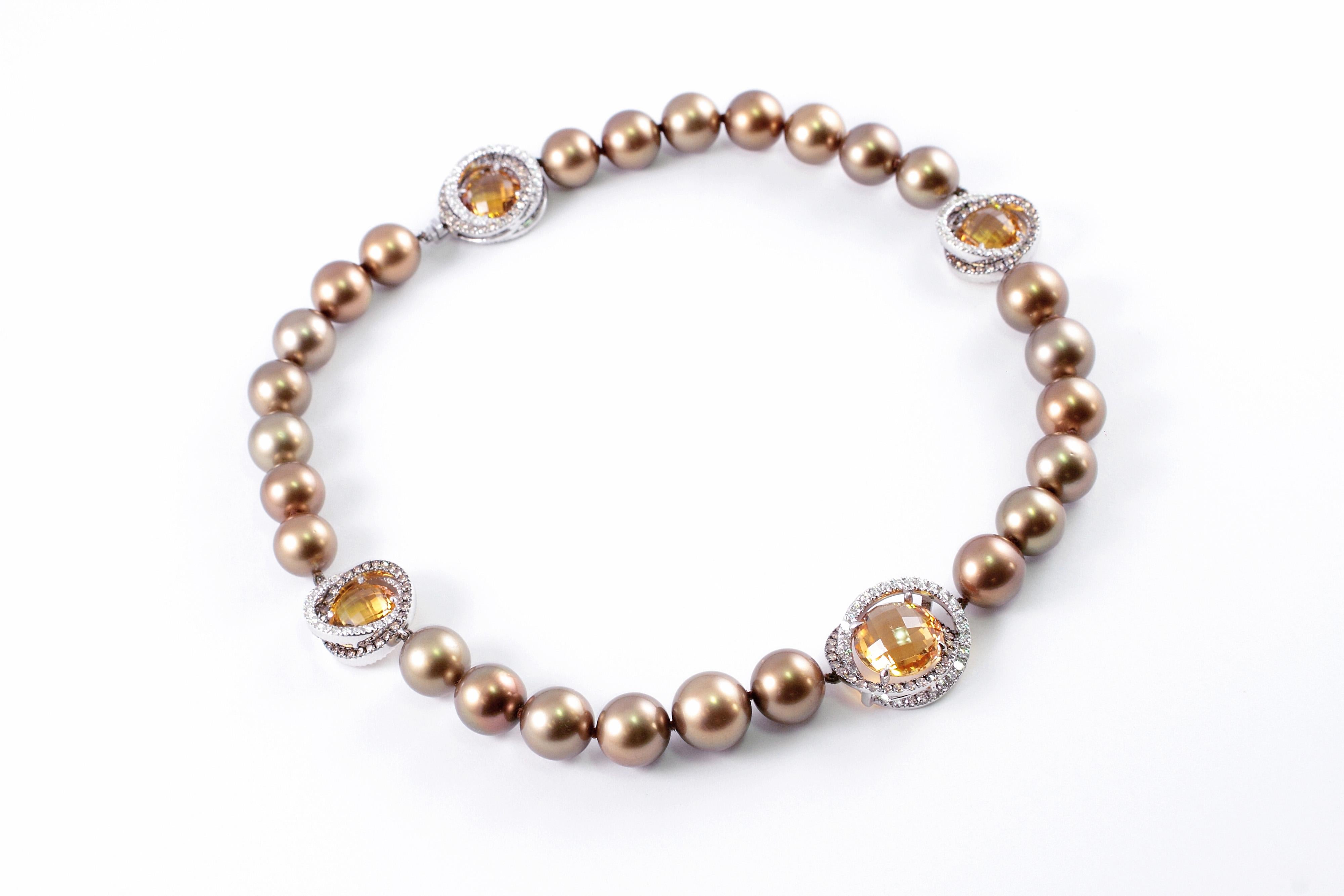 By famed Australian jewelry designer Margot McKinney, this stunning necklace is set with twenty-six 