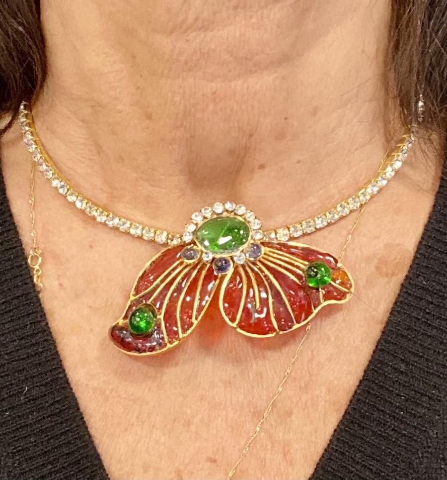 MARGUERITE de VALOIS choker necklace with rhinestones and molten glass.
This couture jewel was made in the Parisian workshops MARGUERITE de VALOIS. 
Set with rhinestones on gold metal, this necklace has a shape of butterfly wings.
It is handcrafted