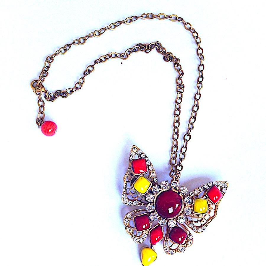 Couture! MARGUERITE DE VALOIS couture butterfly brooch necklace.
Marguerite de Valois butterfly brooch necklace, in yellow, ruby and coral molten glass, set with Swarovski rhinestones. Chain in aged gilt metal with fine gold. 
This necklace is made