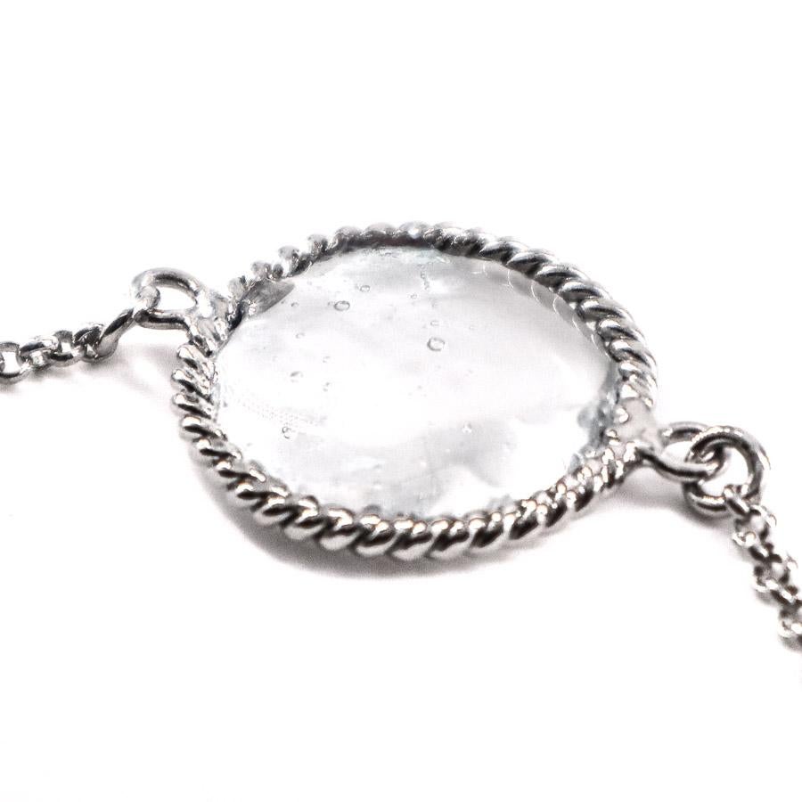 The jewel was handmade by French jewelers from Maison MARGUERITE DE VALOIS. 
The bracelet comes here in its simplest form: a silver metal chain with a transparent molten glass cabochon as its central element.
The jewel is in perfect condition, it
