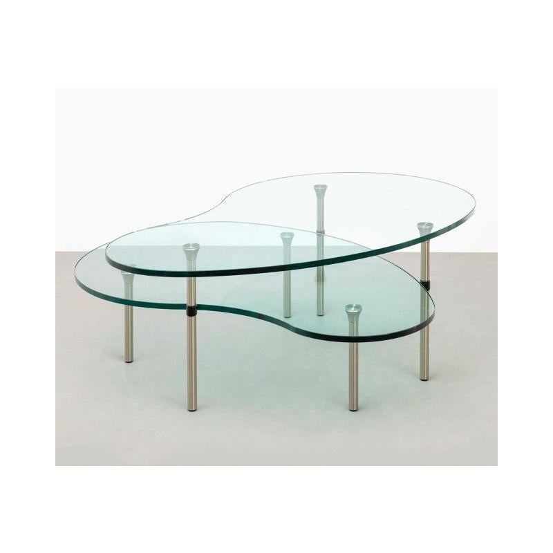 Mari Enzo Pair of 'Ambo' Side Tables for Zanotta, 1987

Brushed nickel-plated brass structure, glass top.

Dimension: 
H 40 x W 109 x D 70 cm
H 25 x W 108 x D 68 cm.