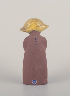 Mari Simmulson for Upsala Ekeby. Ceramic figurine of a girl with two cats