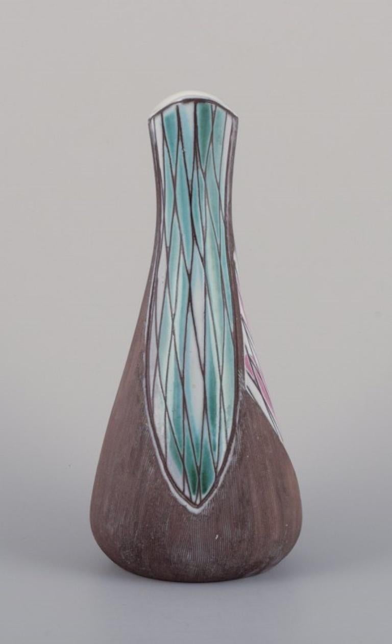 Mari Simmulson (1911-2000) for Upsala Ekeby, Sweden. 
Ceramic vase with abstract motifs.
Approximately from the 1960s.
Model number 4717.
Marked.
In perfect condition.
Dimensions: H 24.0 cm x D 10.5 cm.

Mari Simmulson is recognized as a prominent