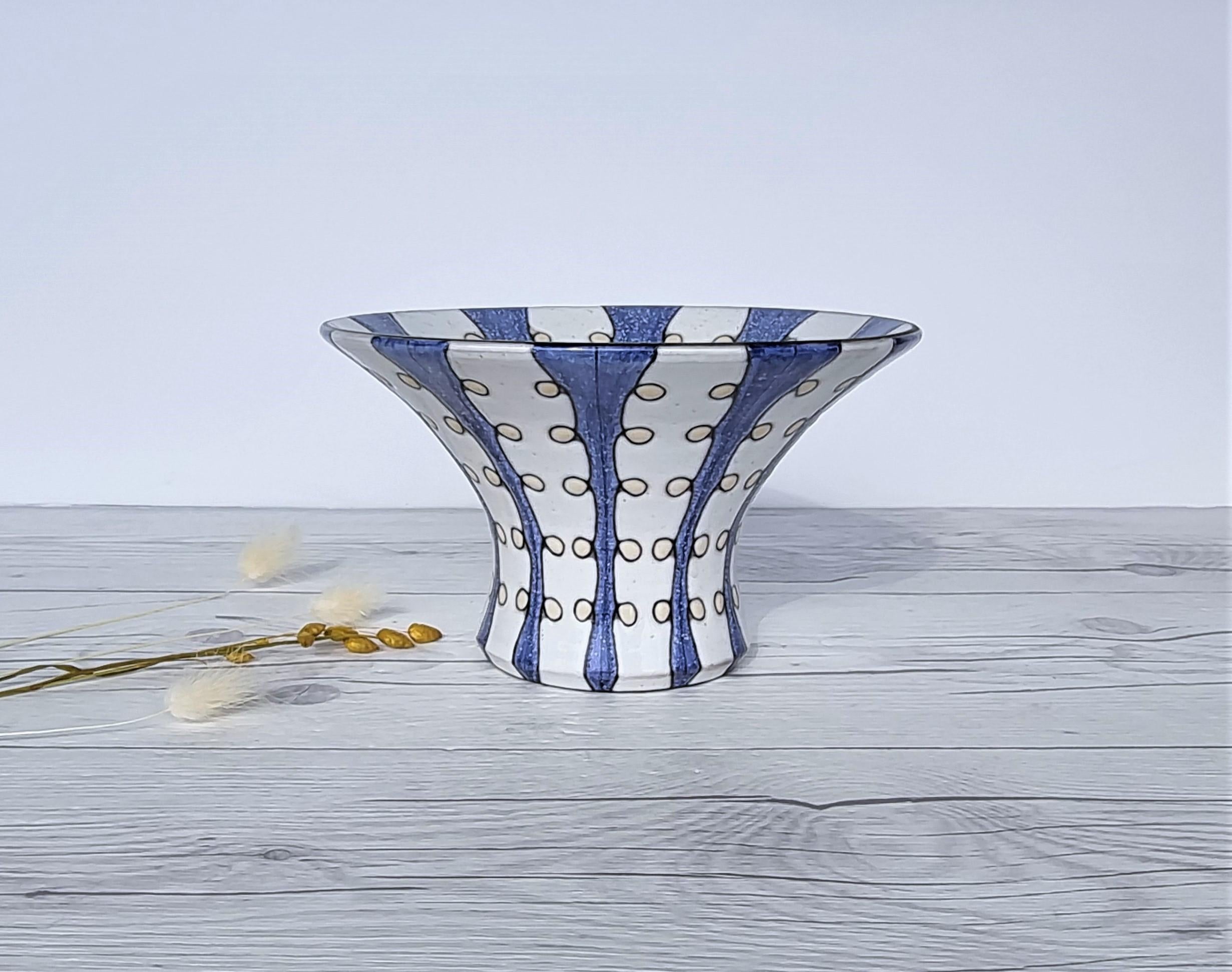 This delicious work of Swedish Mid-Century Modern design is by Mari Simmulson (b. 1911- d. 2000) for Upsala Ekeby. Simmulson was a celebrated Swedish ceramics designer and ceramicist, known for many series she designed at Upsala Ekeby which went on