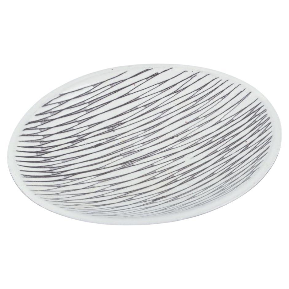 Mari Simmulson for Upsala Ekeby.  Low ceramic bowl with line pattern
