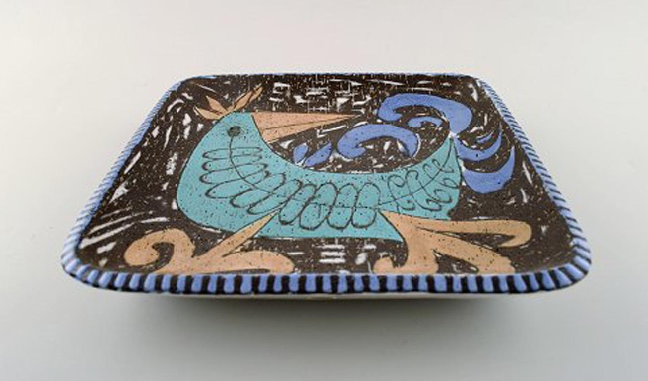 Mari Simmulson for Upsala-Ekeby, Sweden. Art pottery dish. Colorful bird.
Sweden, 1950s-1960s.
In perfect condition.
Measures: 27 cm x 27 cm x 4.5 cm.
Stamped.