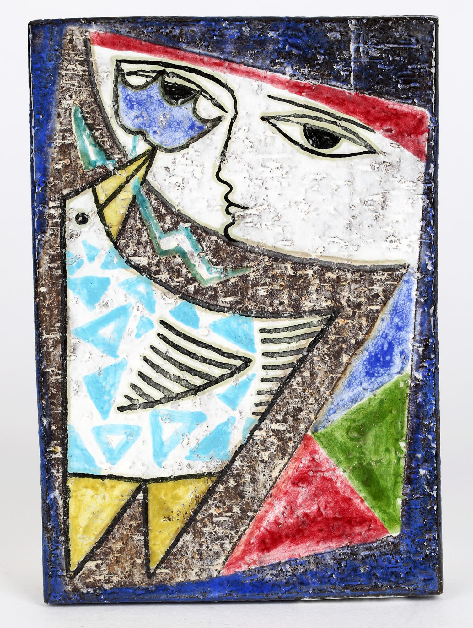 A striking Swedish mid-century wall plaque decorated with an abstract stylized bird and a girl by Mari Simmulson (1911-2000) for Upsala-Ekeby. The stoneware plaque is of rectangular shape and is decorated with a geometrical patterned bird presenting