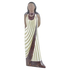 Mari Simmulson, Upsala Ekeby. Ceramic figurine of woman in a long dress. 1960s